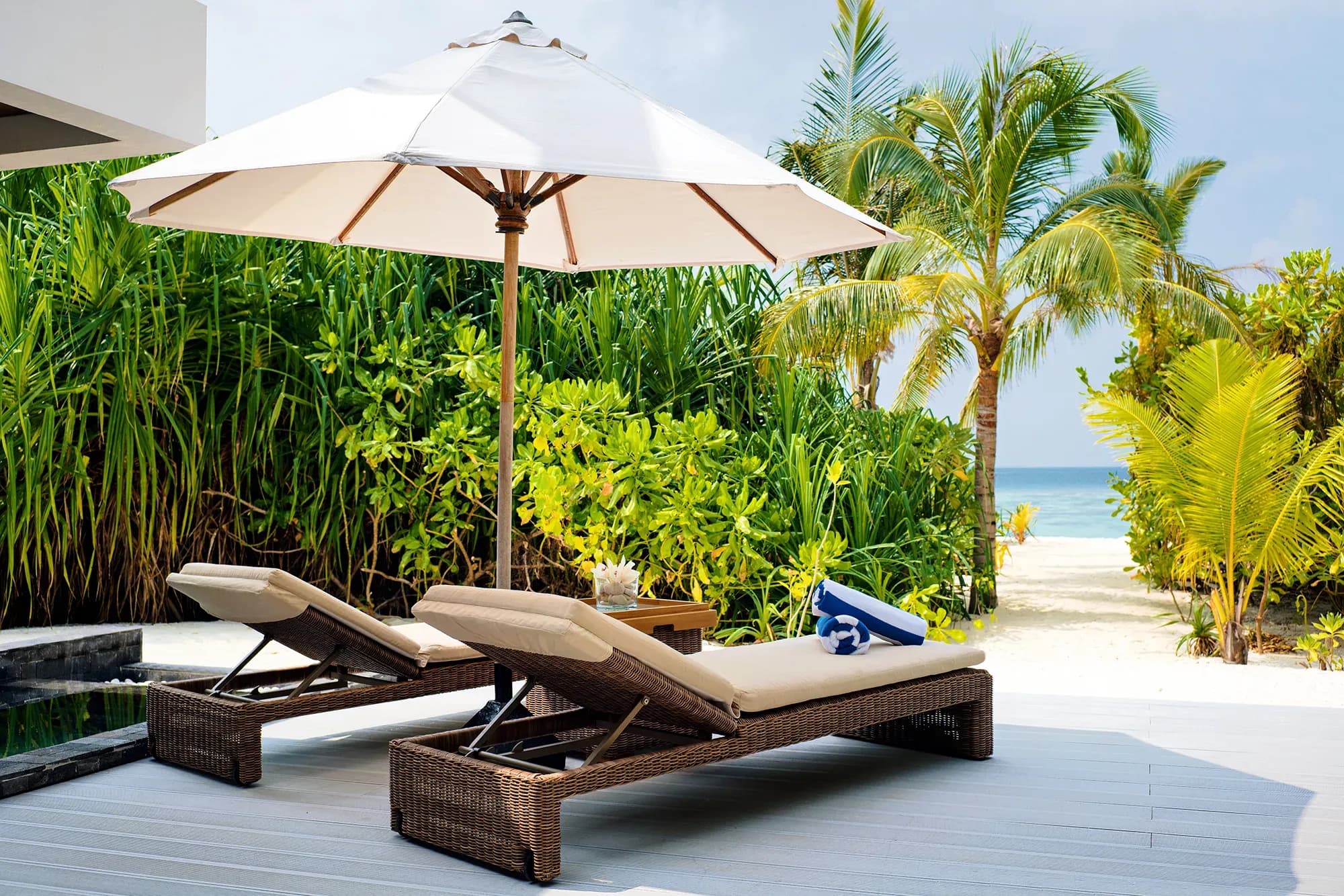 Private pool deck of a Beach Pool Villa Sunset at Kuredhivaru Resort and Spa