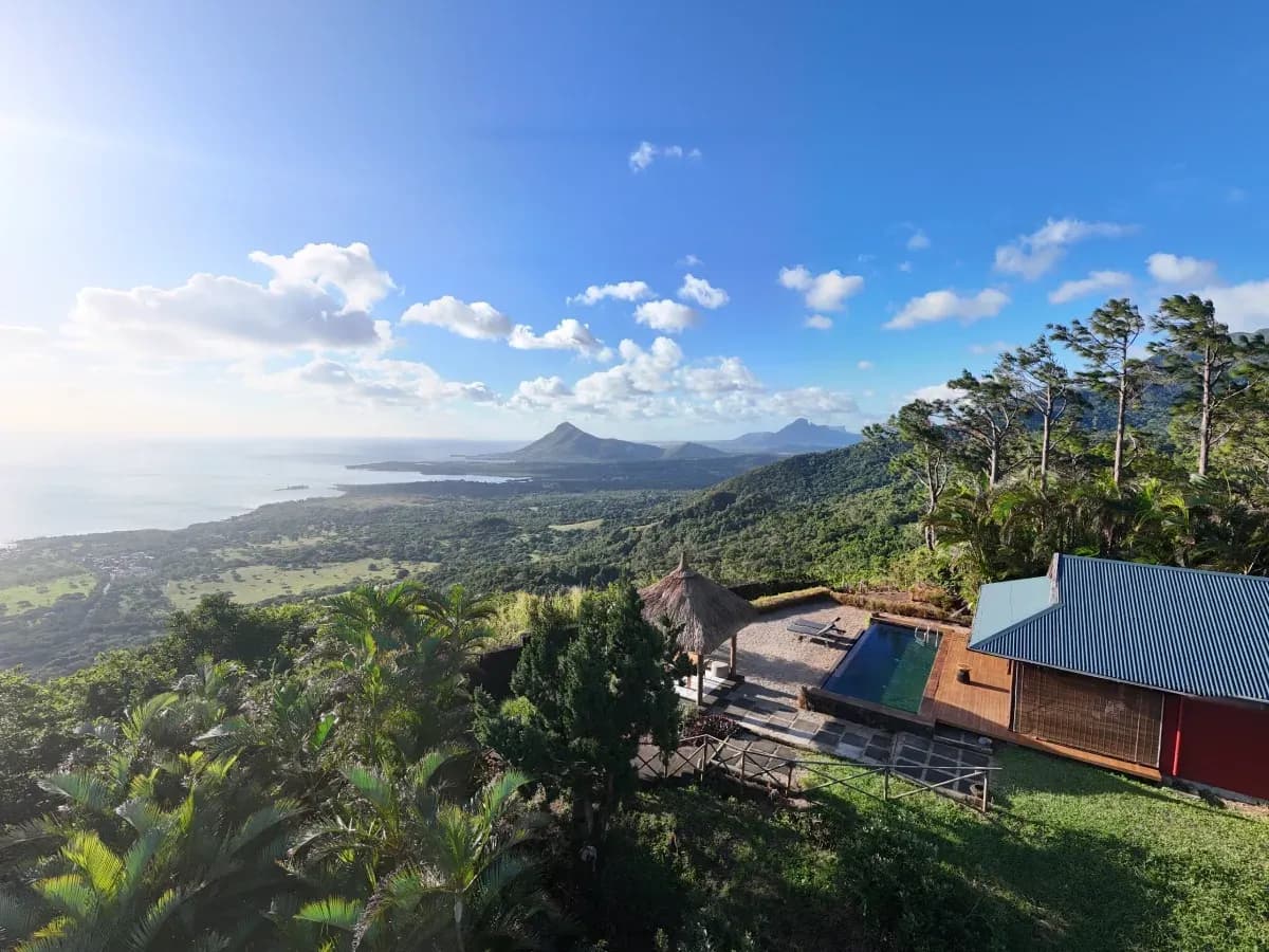 Aerial view from Piton Canot at Lakaz Chamarel Exclusive Lodge, looking over the mountains toward the coast of south-west Mauritius
