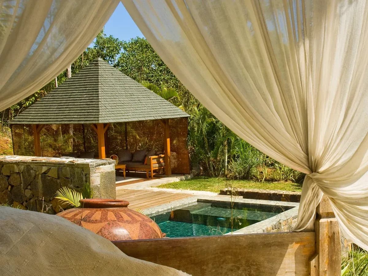 Private pool and thatched pavilion of a Mountain and Garden Pool Suite at Lakaz Chamarel