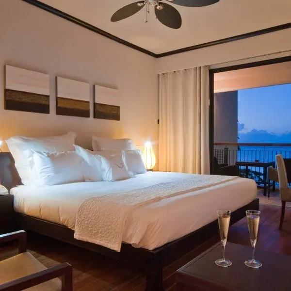Junior Suite bedroom and balcony at Le Cardinal Exclusive Resort