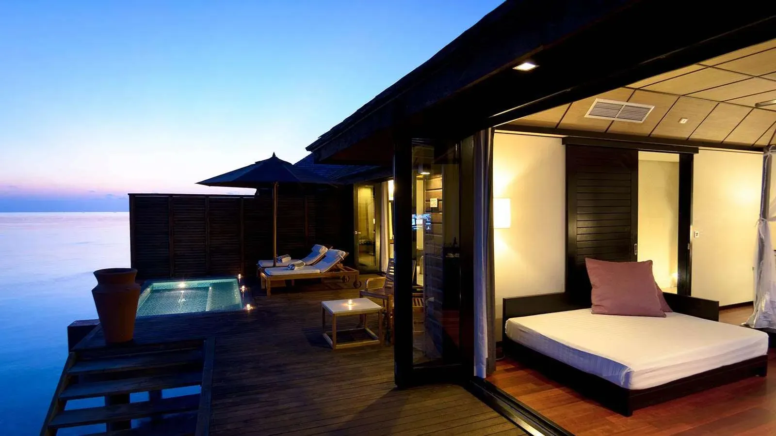 Deluxe Water Villa overwater interior at Lily Beach Resort & Spa