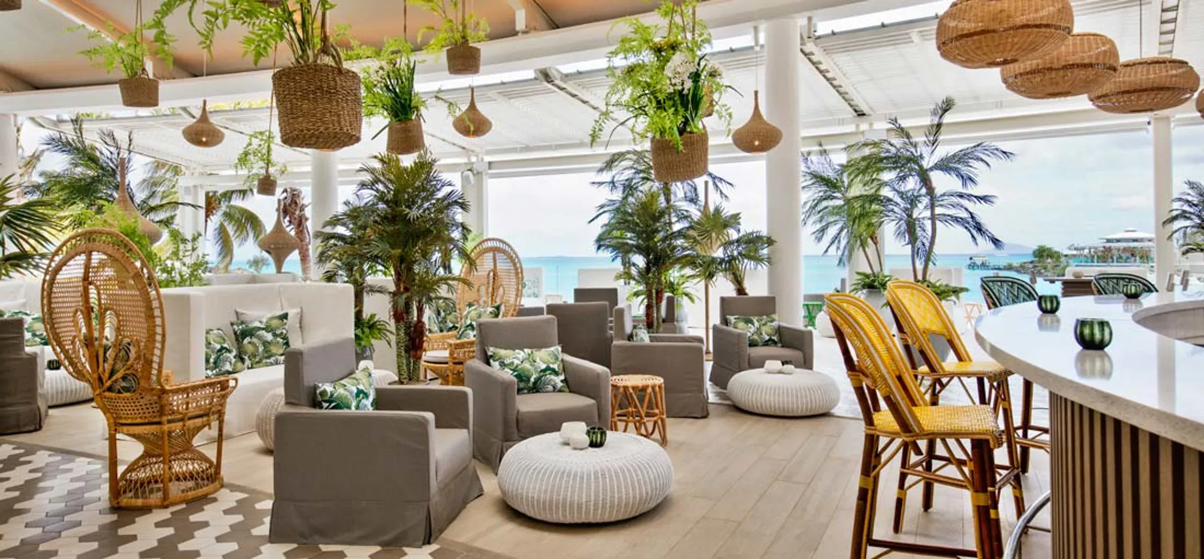 Retro-chic lounge terrace overlooking the lagoon at LUX* Grand Gaube Resort & Villas, Mauritius