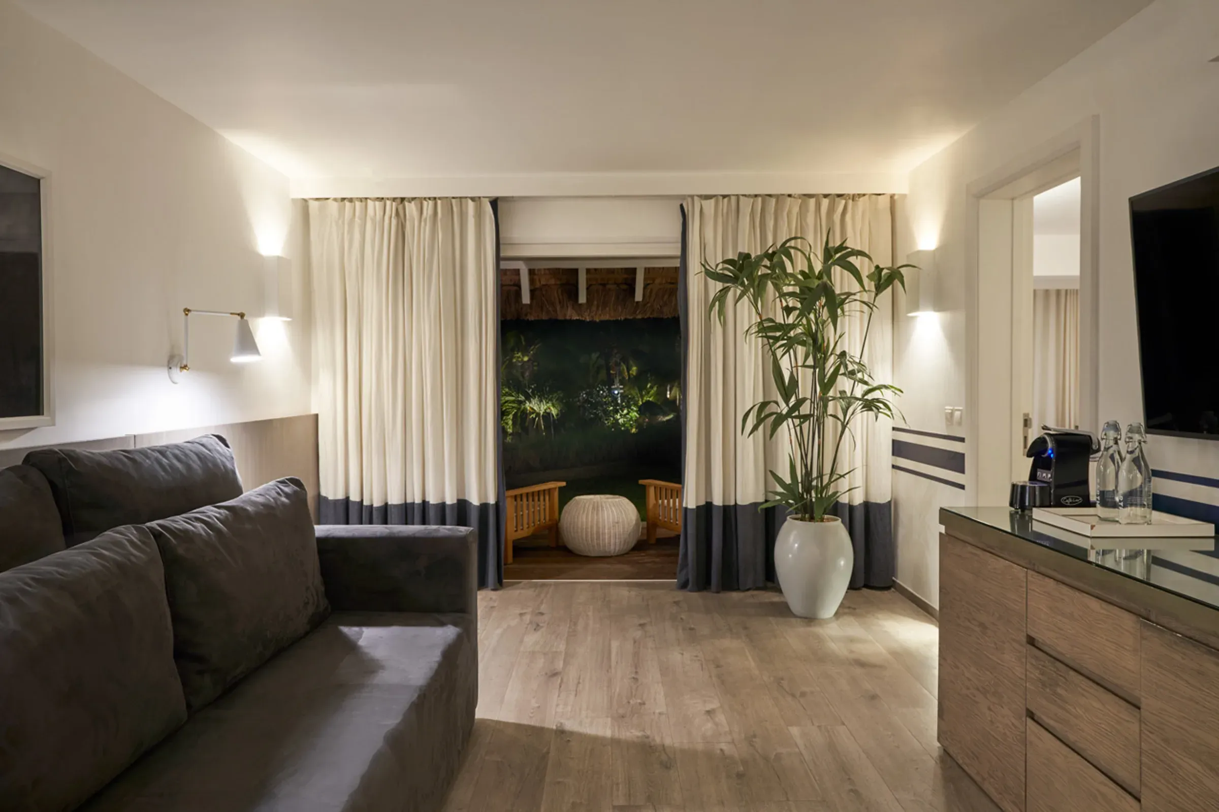 LUX* Suite living area opening onto a private terrace at LUX* Grand Gaube