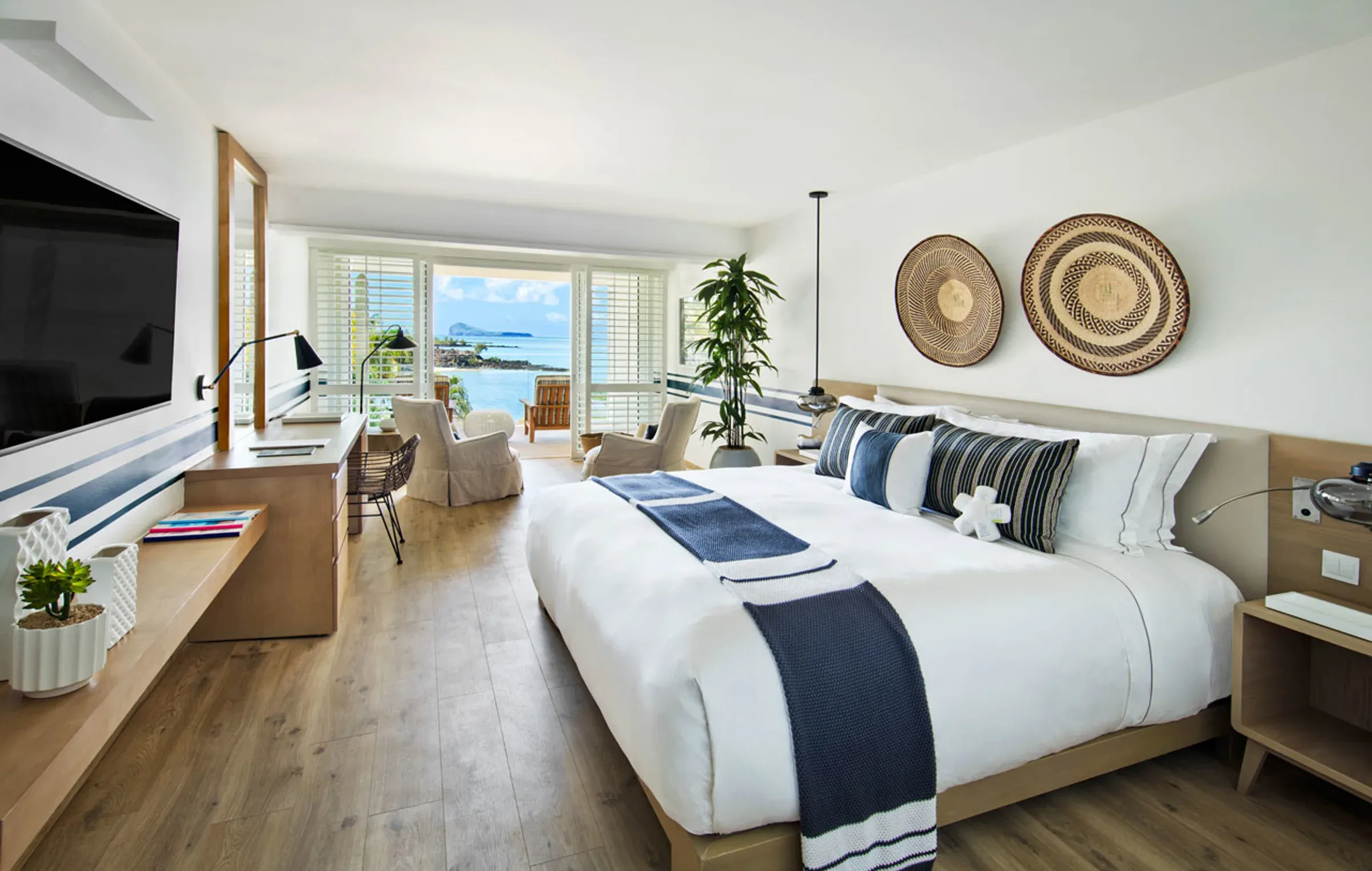 Superior Room interior with lagoon-facing balcony at LUX* Grand Gaube