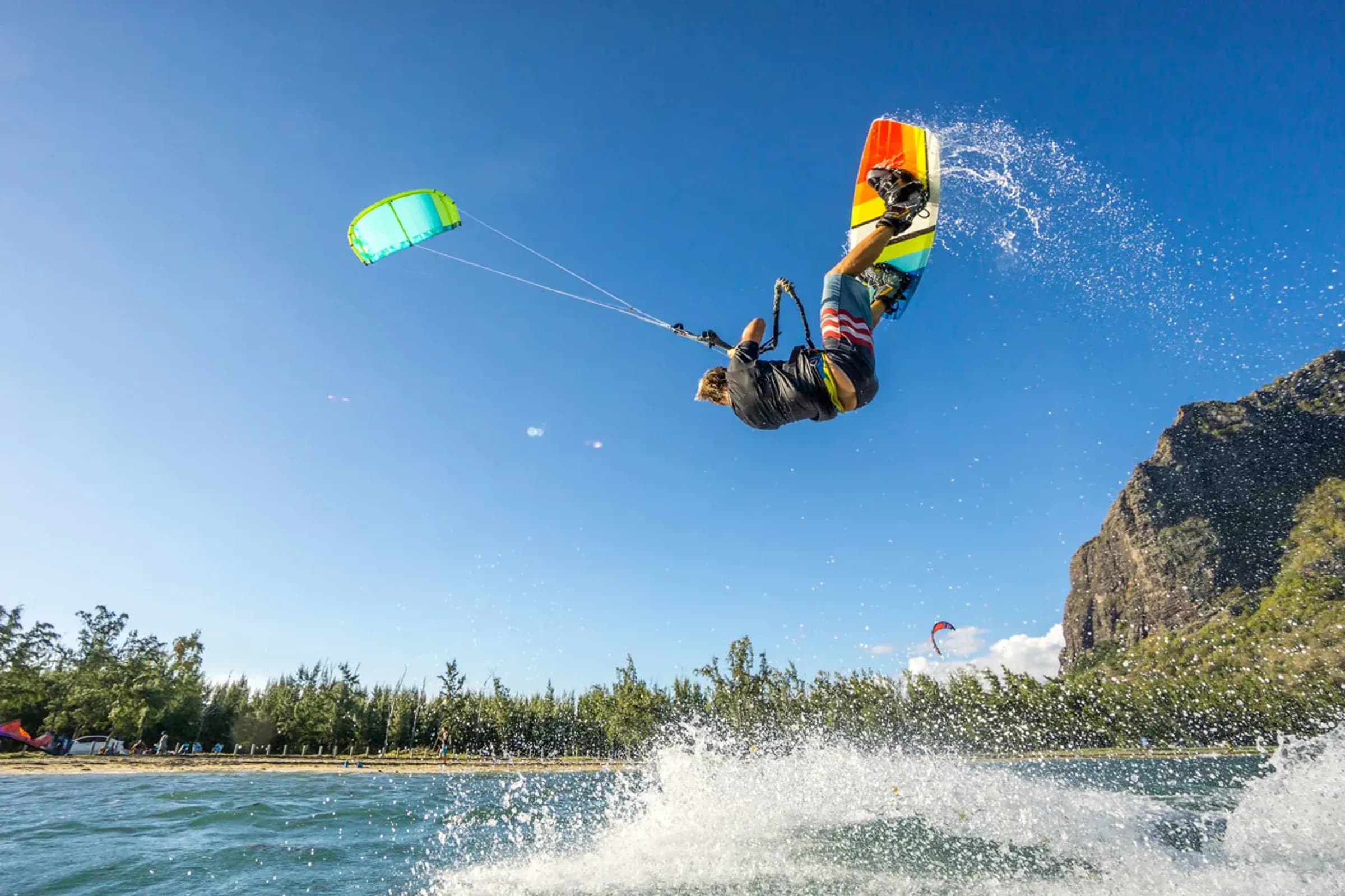 Kitesurfer airborne at Le Morne's Kite Lagoon in front of Le Morne Brabant mountain