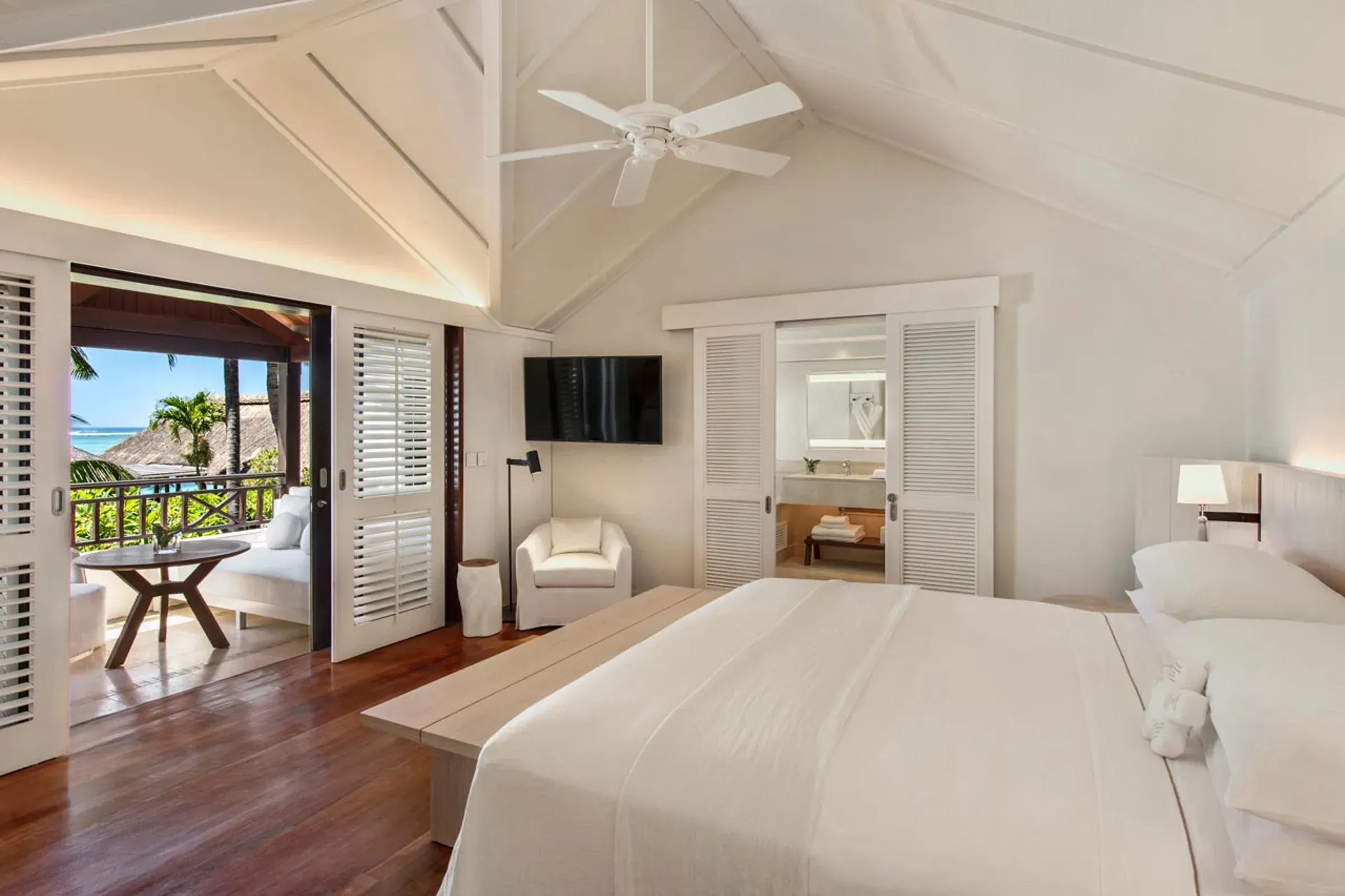 Sunset Junior Suite terrace overlooking the lagoon at LUX* Le Morne Resort