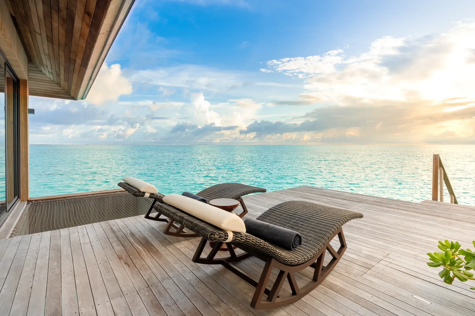 Grand Madifushi Aqua Pool Villa living room opening to the ocean