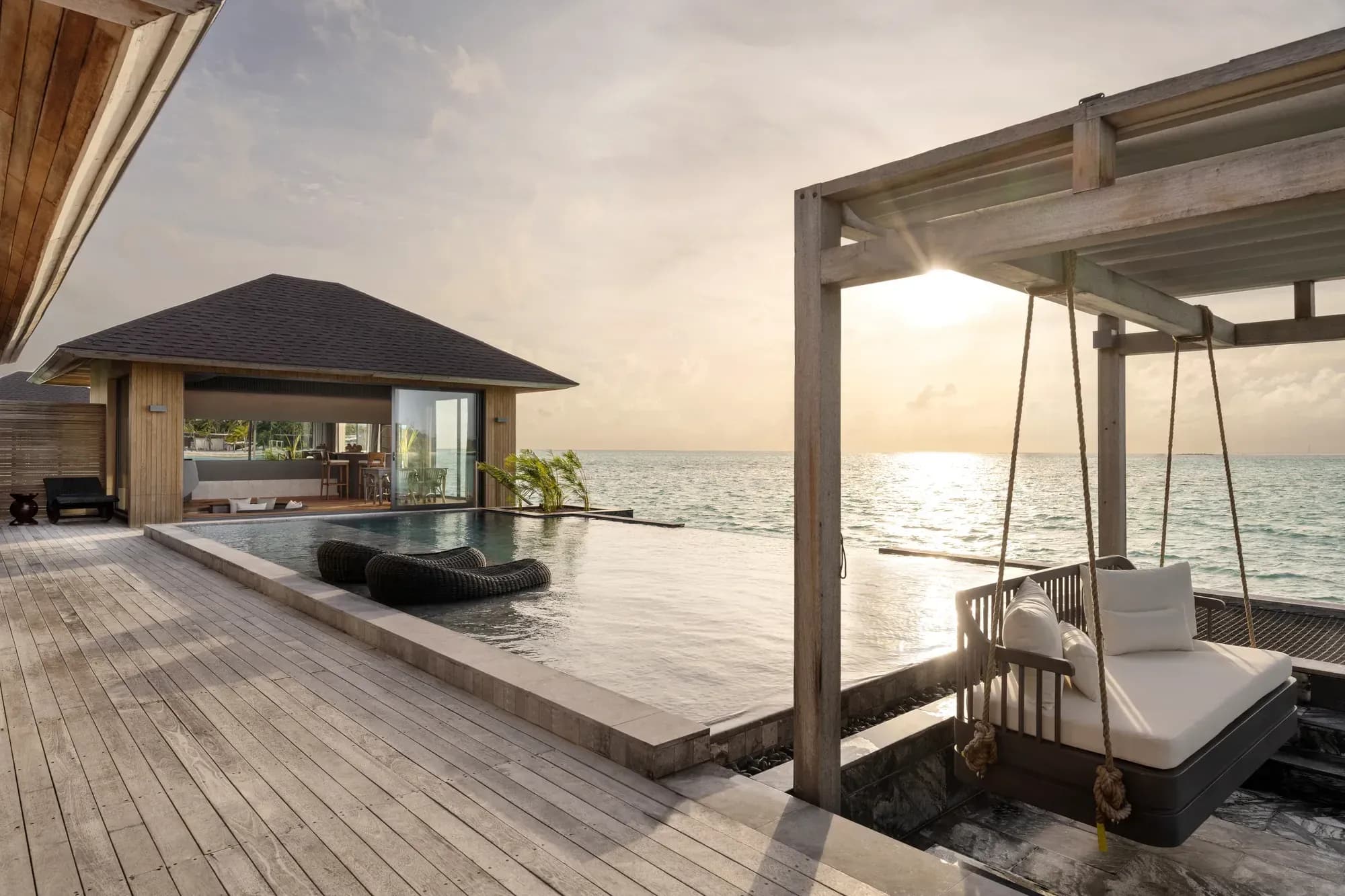 Tranquil Aqua Pool Villa infinity pool and sundeck at sunset