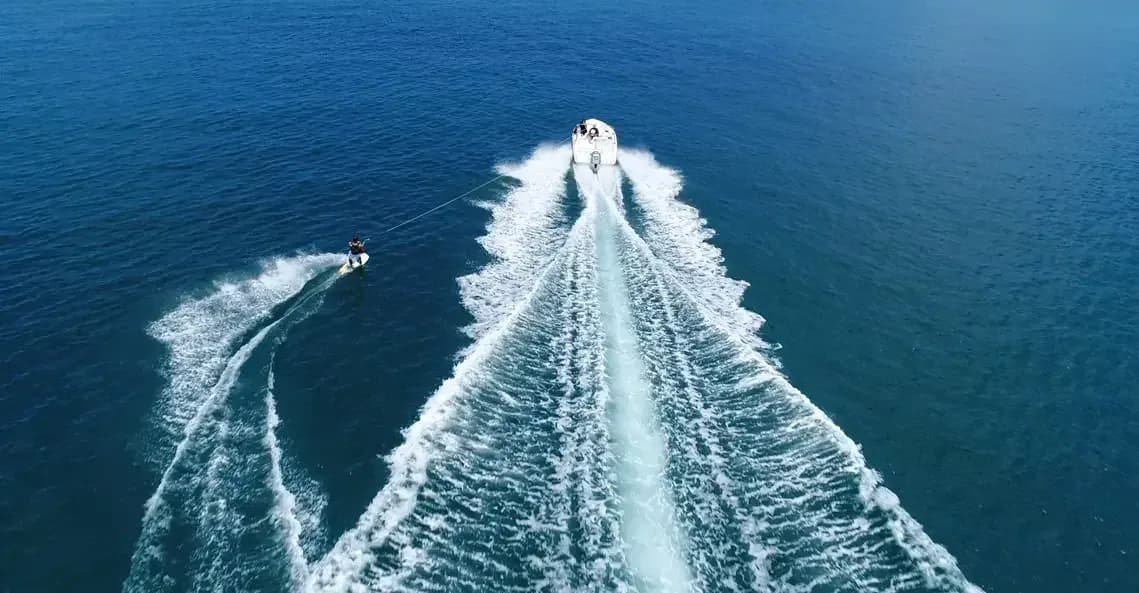 Aerial view of waterskiing off Maradiva's boathouse, Mauritius
