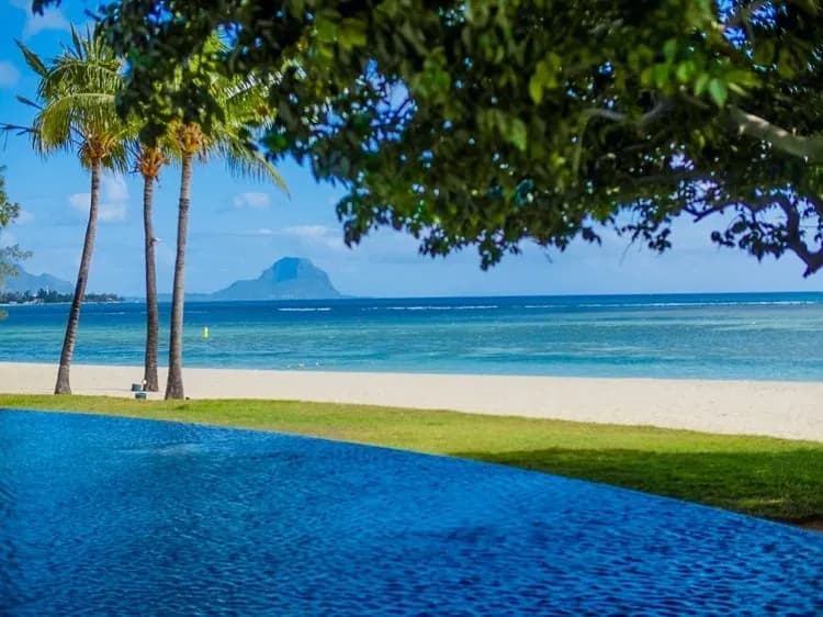 Beach and lagoon with a view of Le Morne mountain from Maradiva Villas Resort & Spa, west coast Mauritius