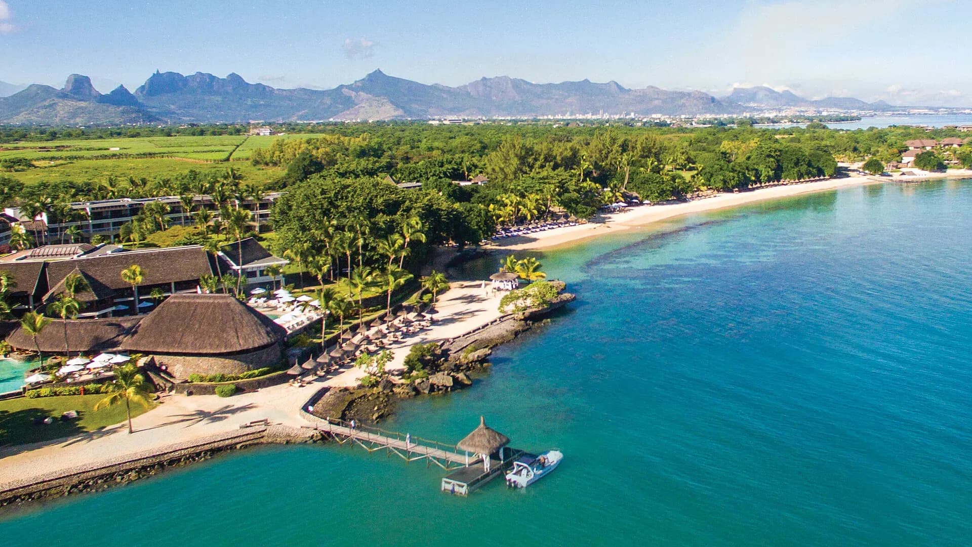 Aerial view of Maritim Resort & Spa Mauritius on Turtle Bay, Balaclava, with mountains beyond