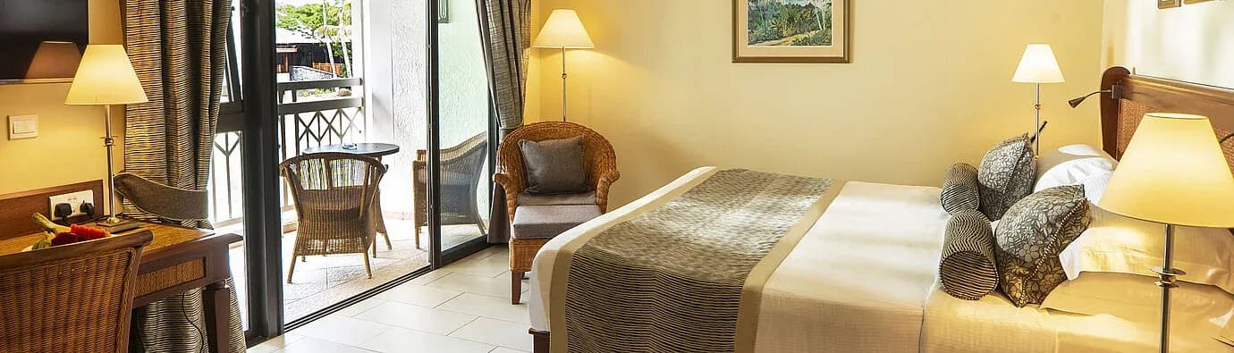 Classic Room interior with balcony seating at Maritim Resort & Spa Mauritius