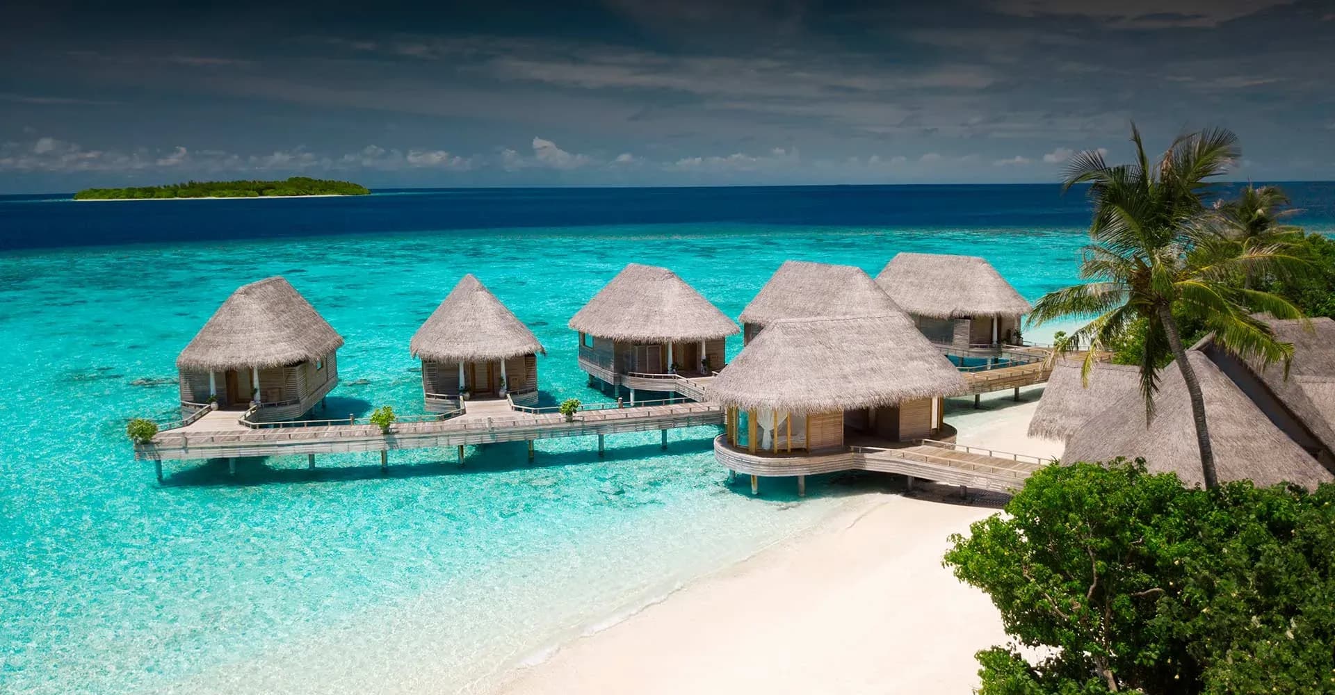 Overwater villas housing Serenity Spa's treatment suites at Milaidhoo