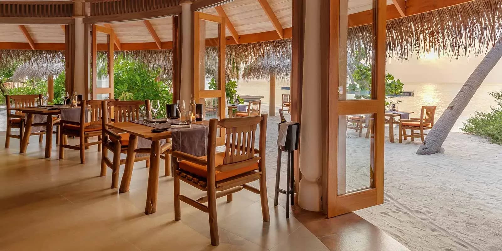 The Shoreline Grill dining pavilion overlooking the beach at Milaidhoo