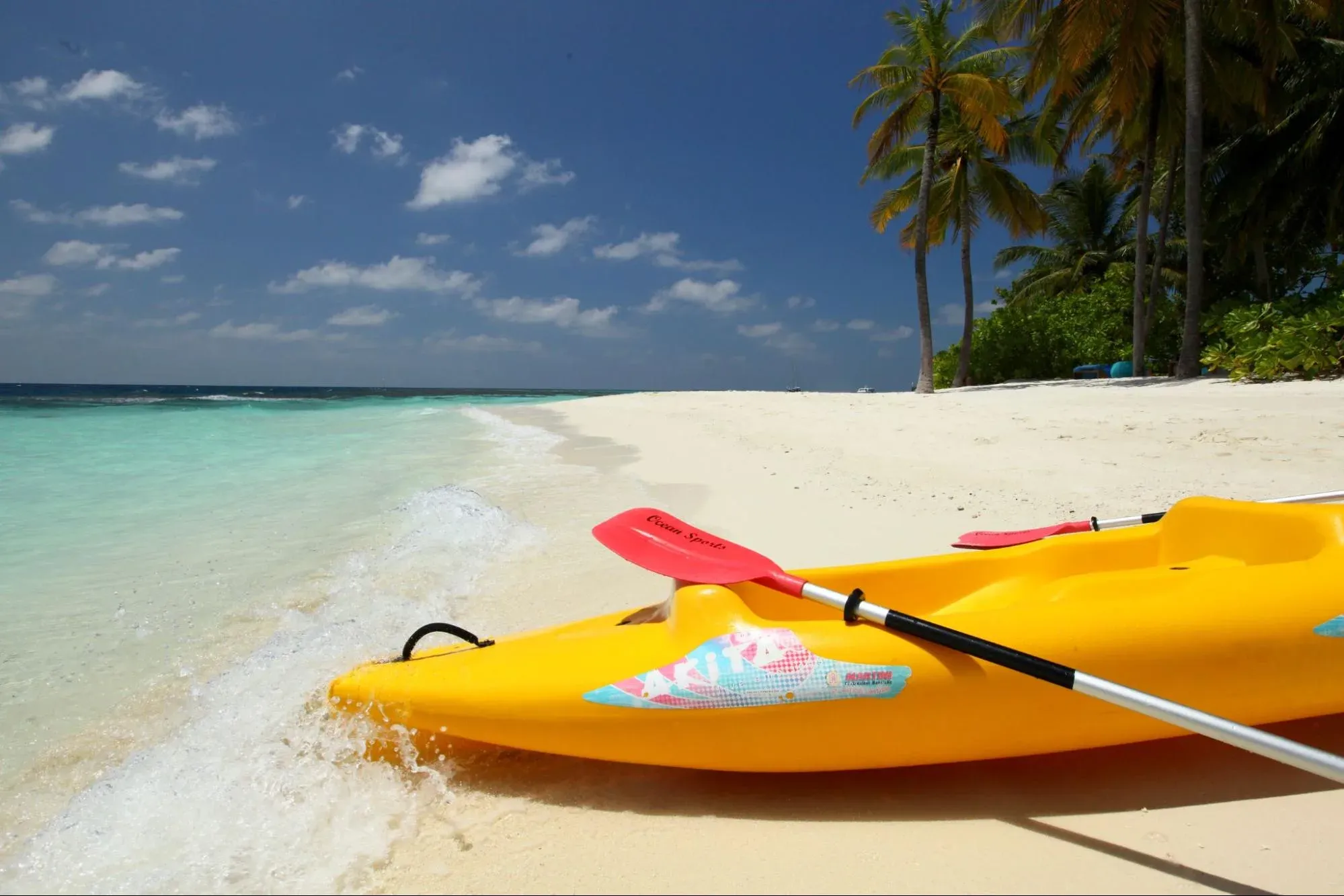 Kayak and paddle on the beach at V Villas Maldives at Mirihi