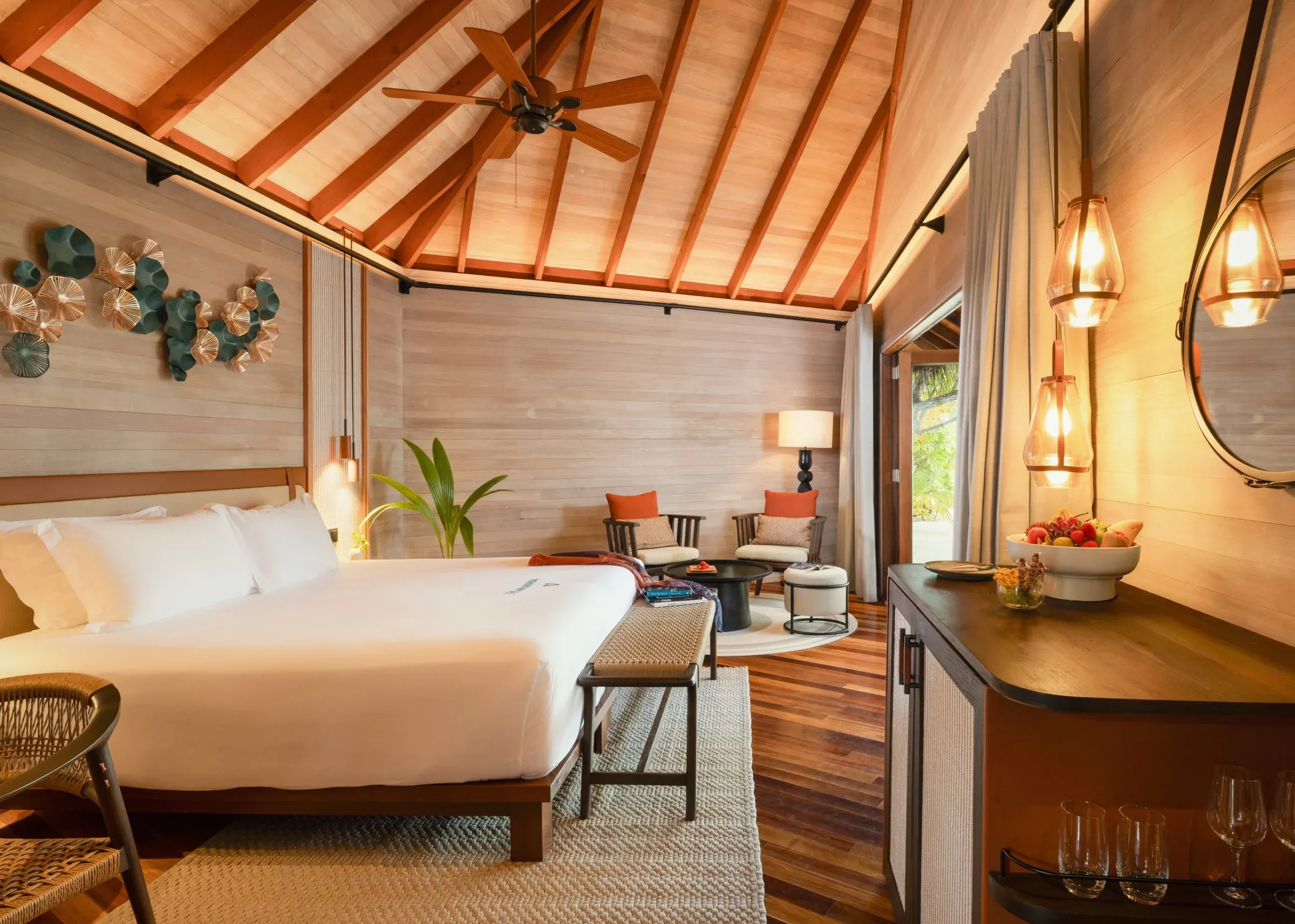 Beach Villa bedroom with vaulted thatched ceiling at V Villas Maldives at Mirihi