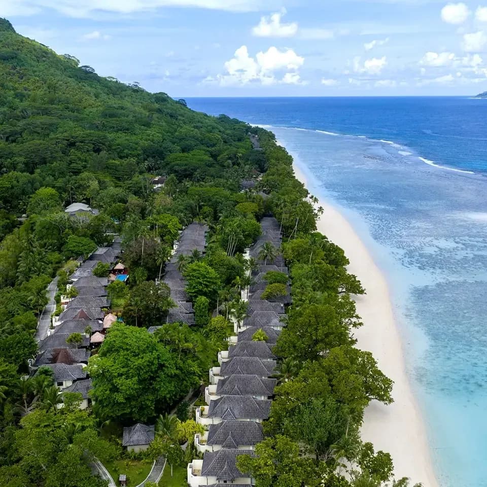 Aerial view of villas nestled among the rainforest canopy at Niva Labriz Seychelles