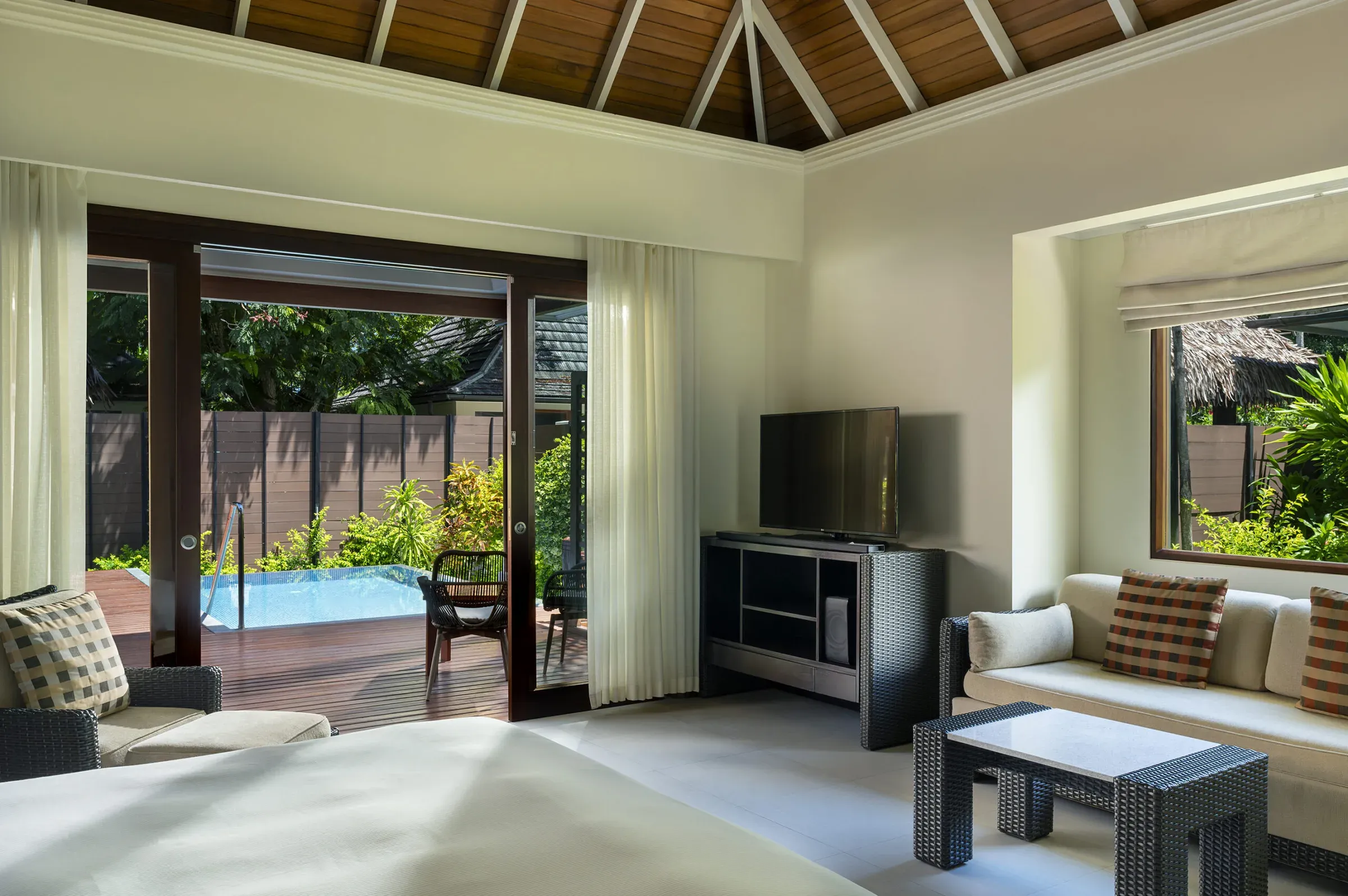 Garden Oasis Pool Villa living space opening to private pool at Niva Labriz Seychelles