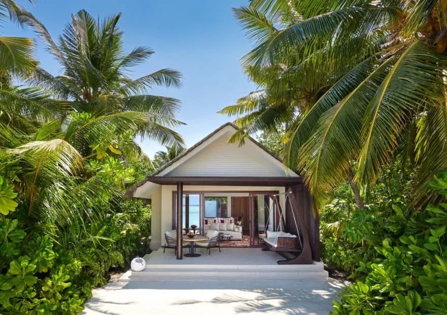 Beach Villa exterior with direct beach access at Niyama Private Islands Maldives