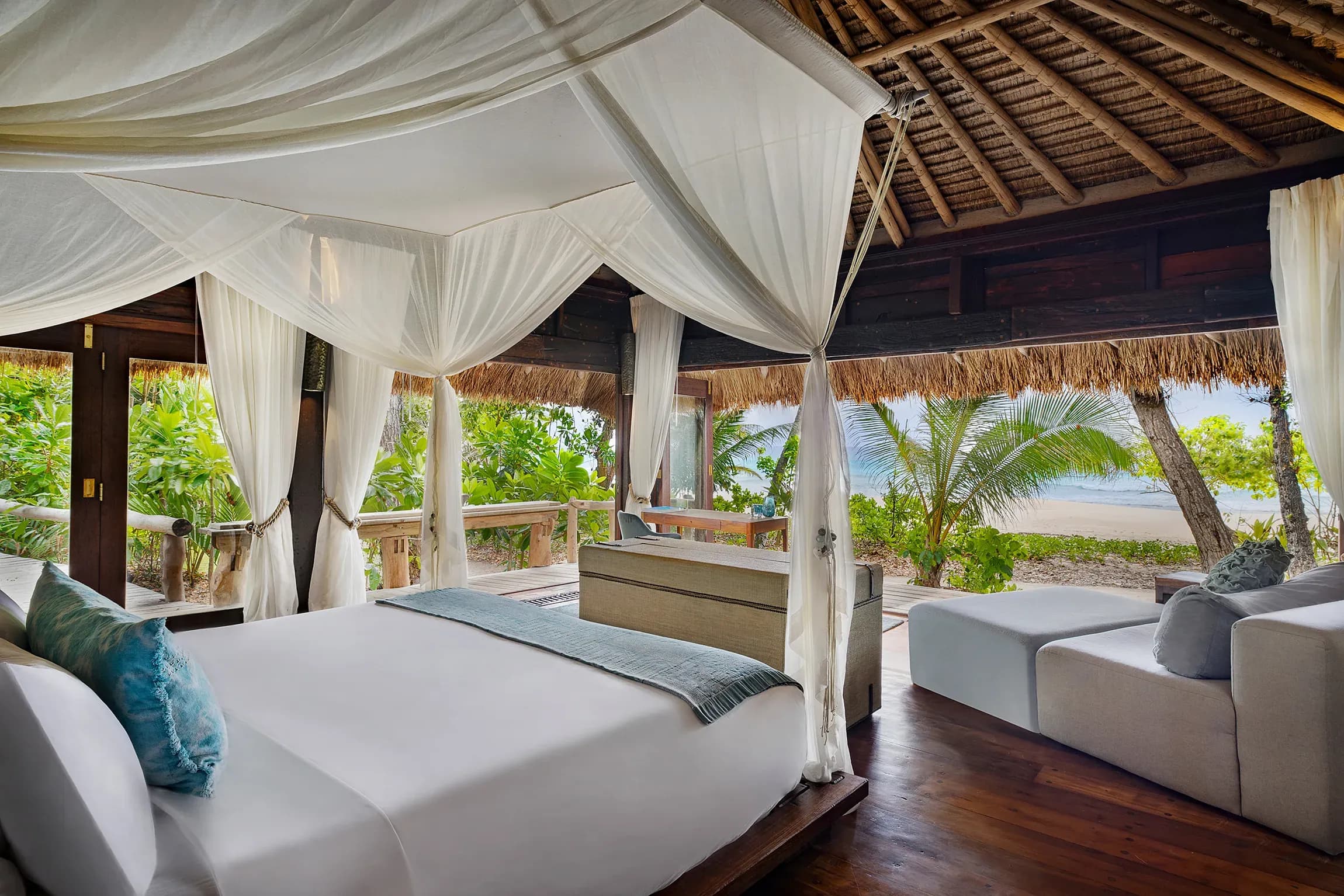 Beachfront Villa bedroom opening onto the garden at North Island, Seychelles