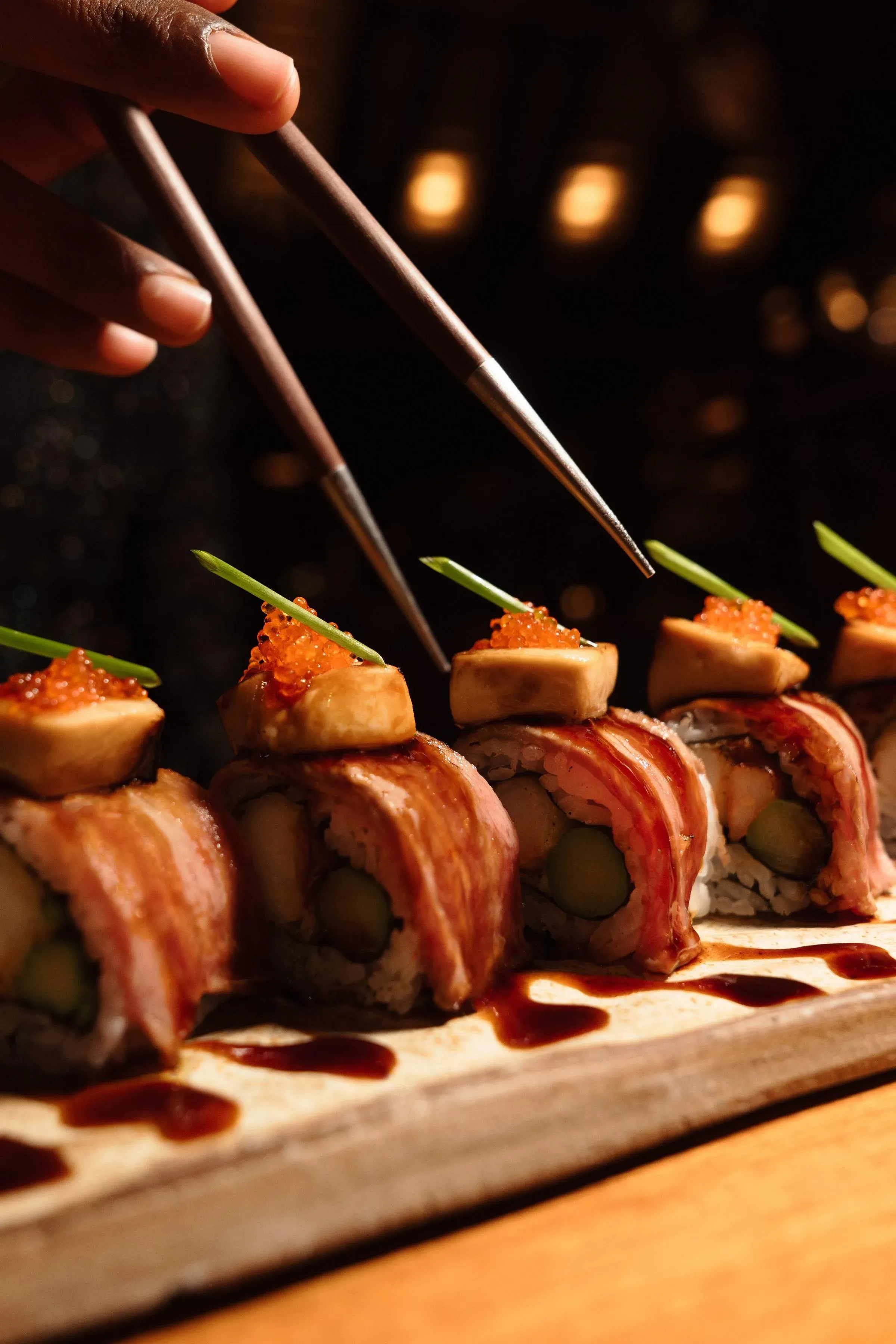 Sushi and sashimi preparation at TAPASAKE, One&Only Le Saint Géran's overwater restaurant