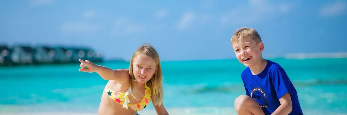 Children playing on the beach at OZEN LIFE MAADHOO