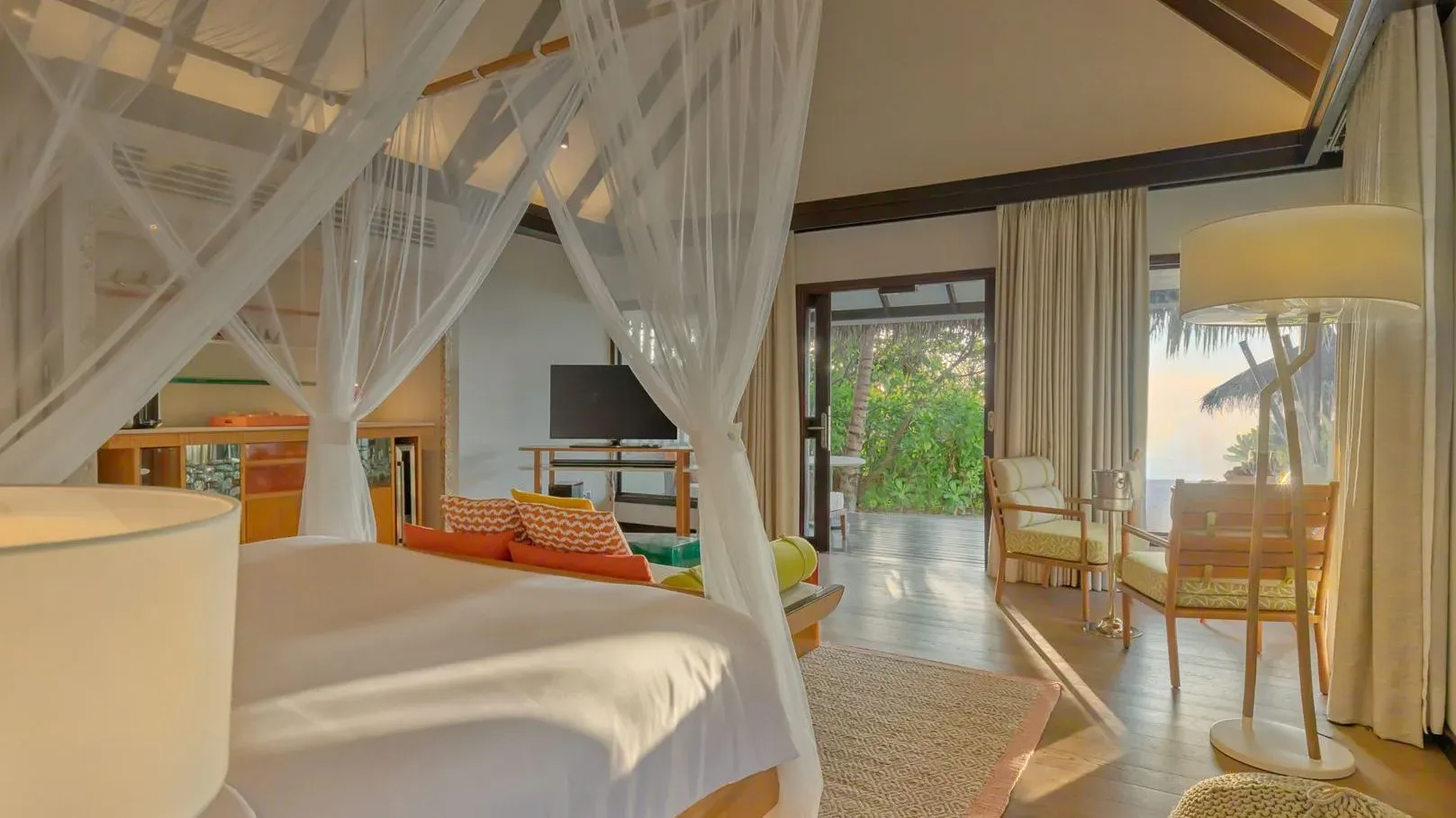 Earth Villa With Pool bedroom interior with canopy bed at OZEN LIFE MAADHOO