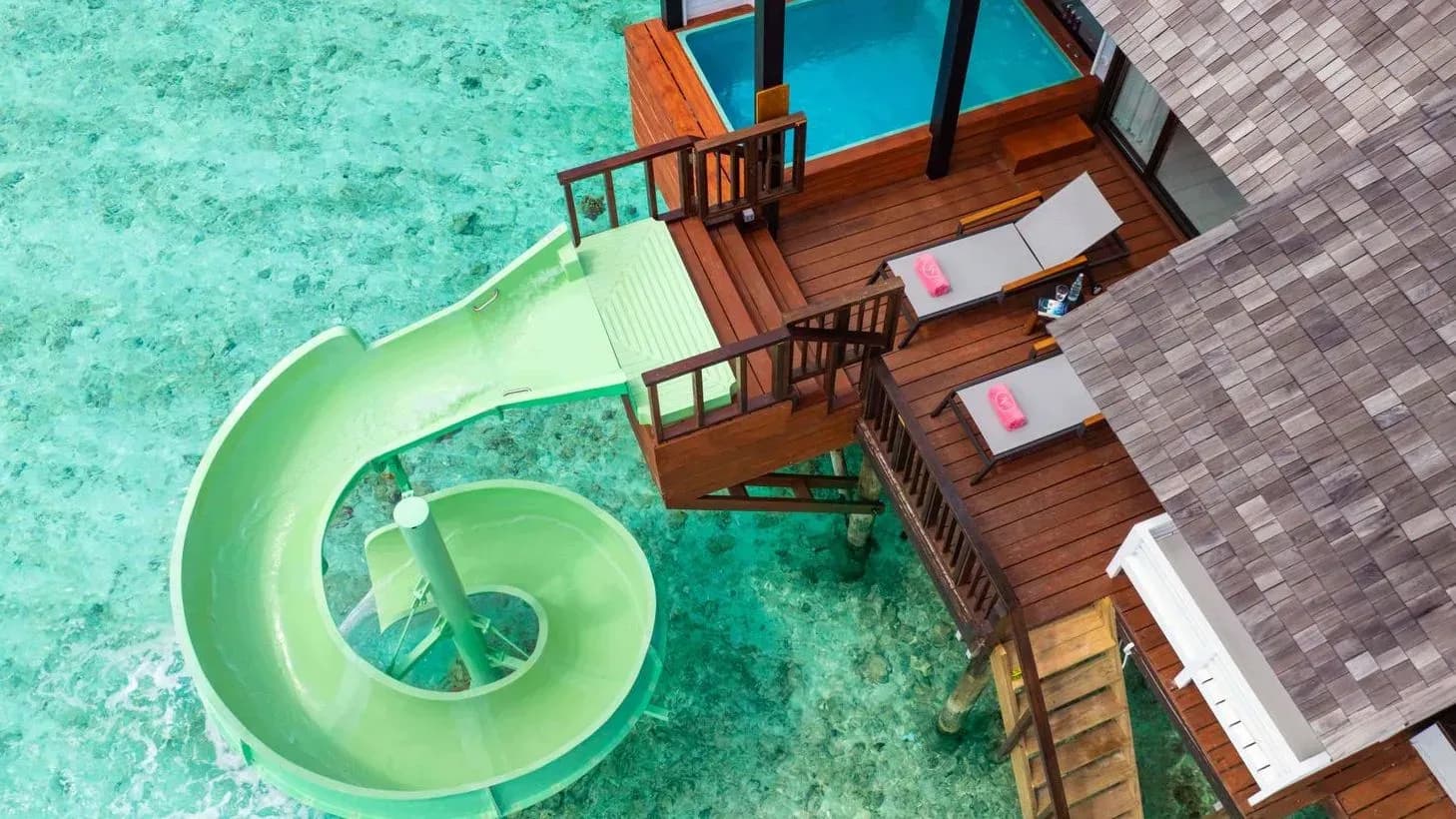 Overwater jacuzzi and spiral water slide at a Wind Villa With Jacuzzi & Slide, OZEN LIFE MAADHOO