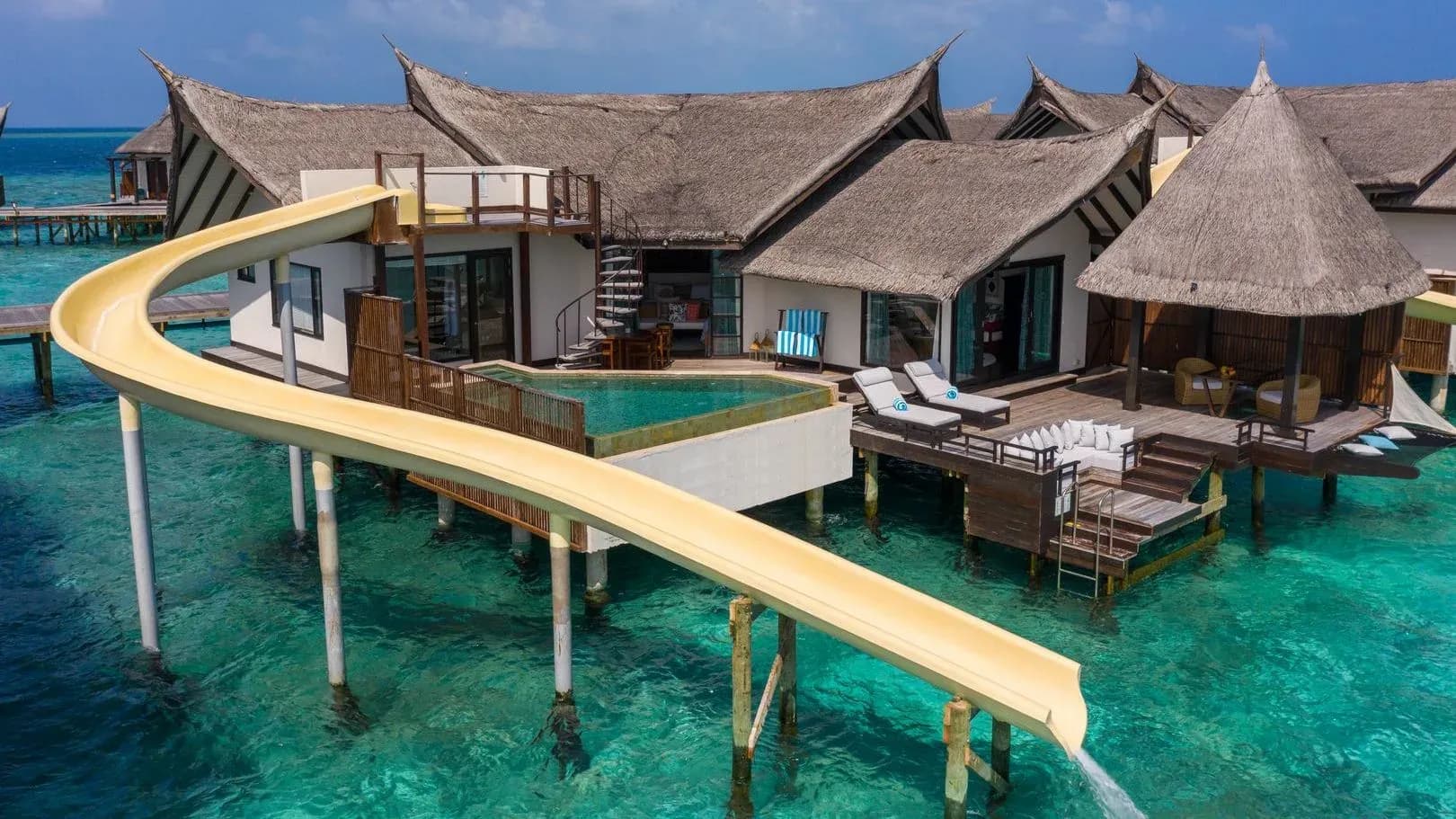 Ocean Pool Suite with Slide overwater villa at OZEN RESERVE BOLIFUSHI