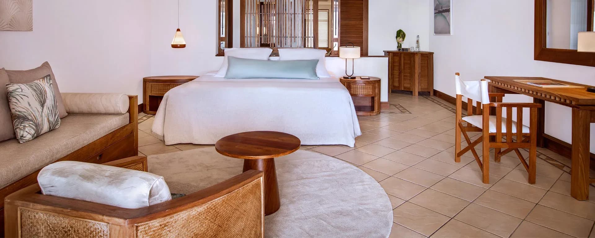 2-Bedroom Family Suite Beachfront bedroom with ocean views at Paradis Beachcomber
