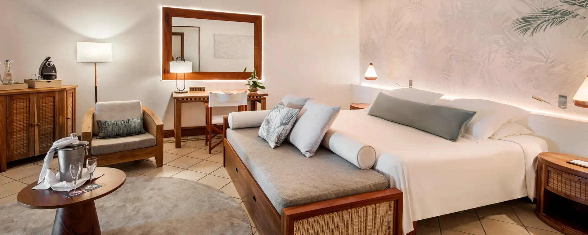 2-Bedroom Family Suite lounge area amid tropical gardens at Paradis Beachcomber