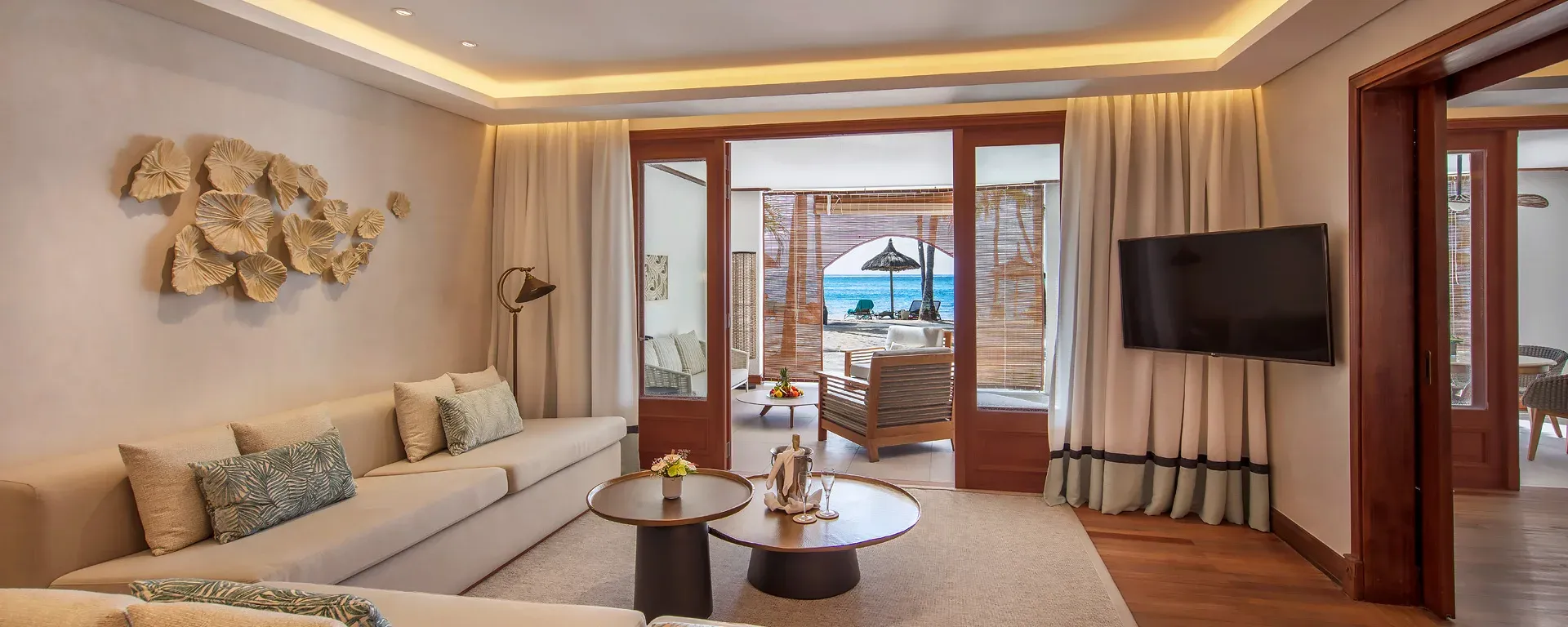 2-Bedroom Senior Family Suite Beachfront terrace dining area at Paradis Beachcomber