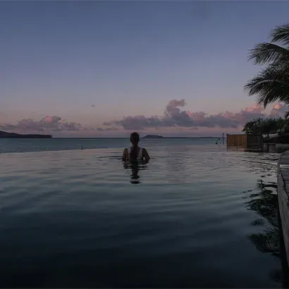 Infinity pool at dusk on the Peninsula at Paradise Cove Boutique Hotel