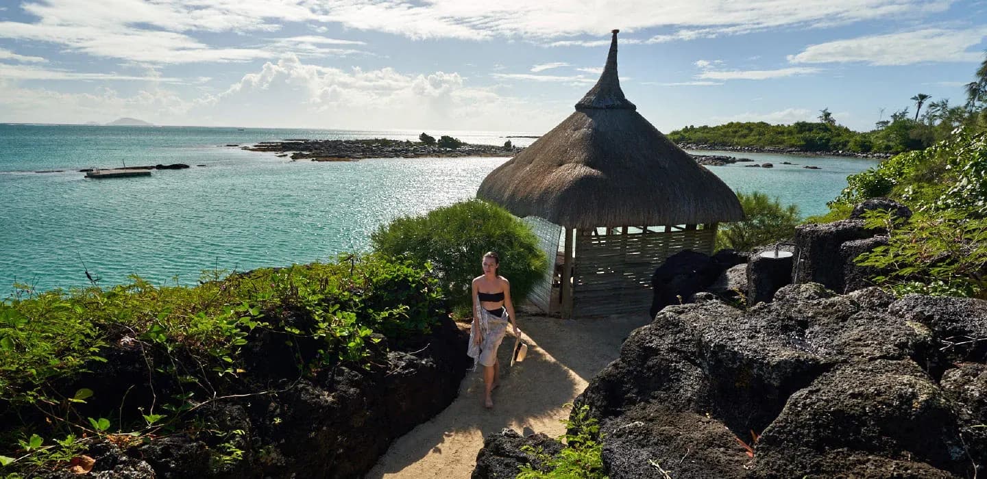 Thatched pavilion along the secluded path to the Peninsula at Paradise Cove Boutique Hotel