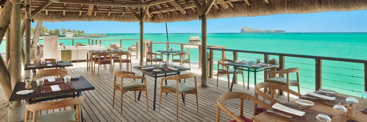 Peninsula Restaurant overwater deck with lagoon view at Paradise Cove Boutique Hotel