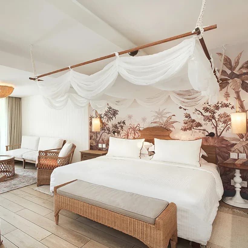 Junior Suite bedroom and lounge area at Paradise Cove Boutique Hotel