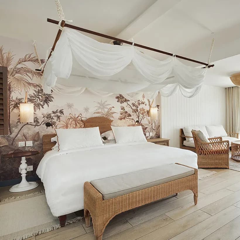 Prestige Junior Suite with canopy bed and tropical mural at Paradise Cove Boutique Hotel