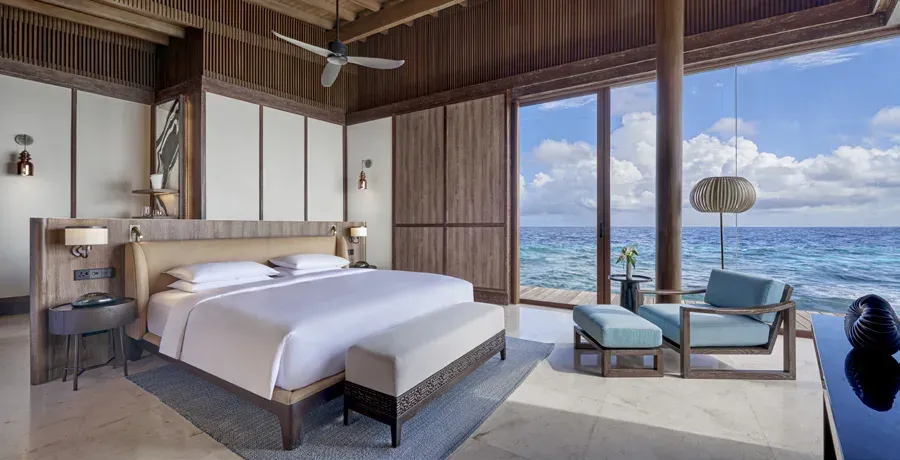 Overwater Villa bedroom with ocean views at Park Hyatt Maldives Hadahaa