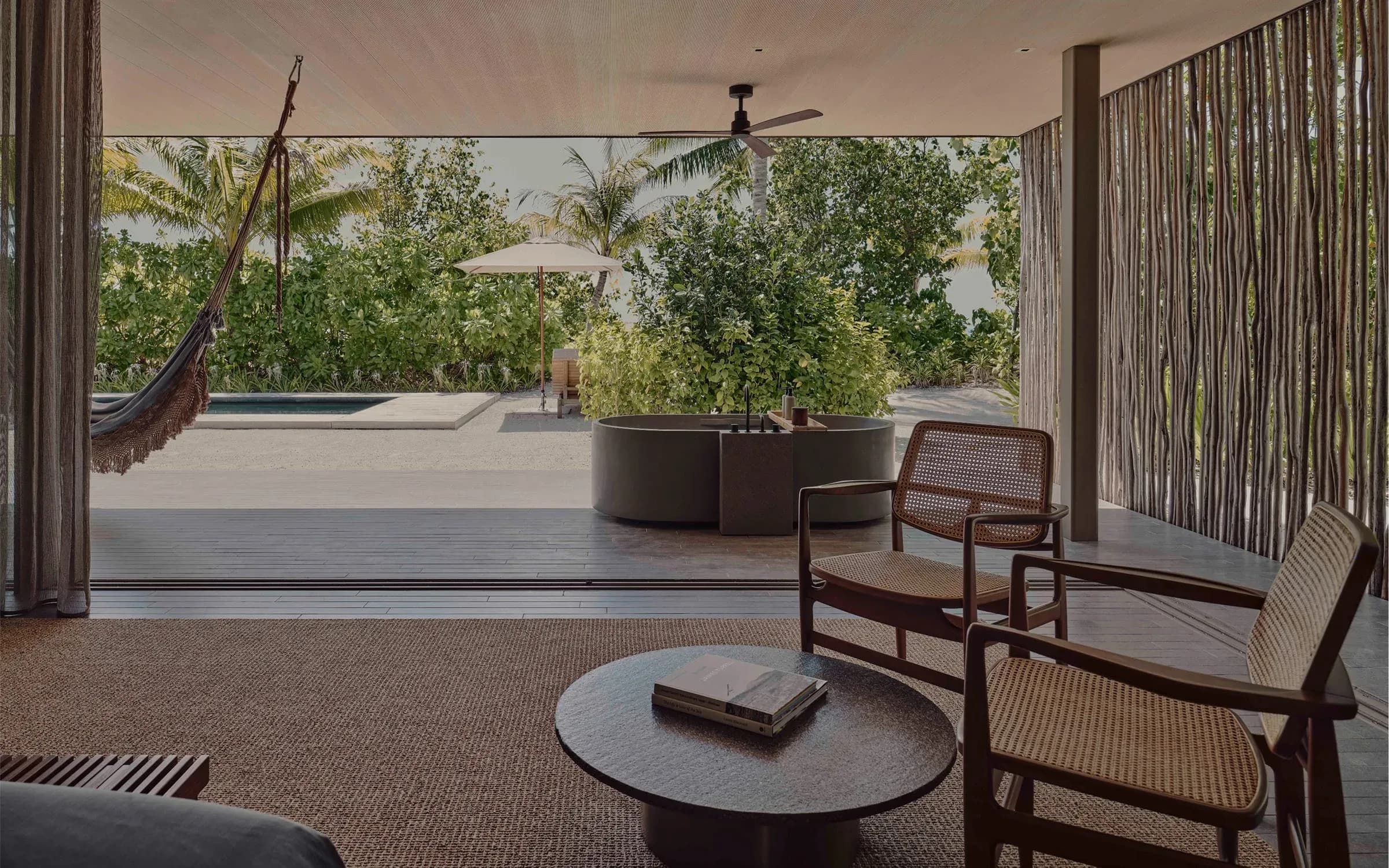 Open-air lounge and private pool at a Two Bedroom Beach Pool Villa, Patina Maldives