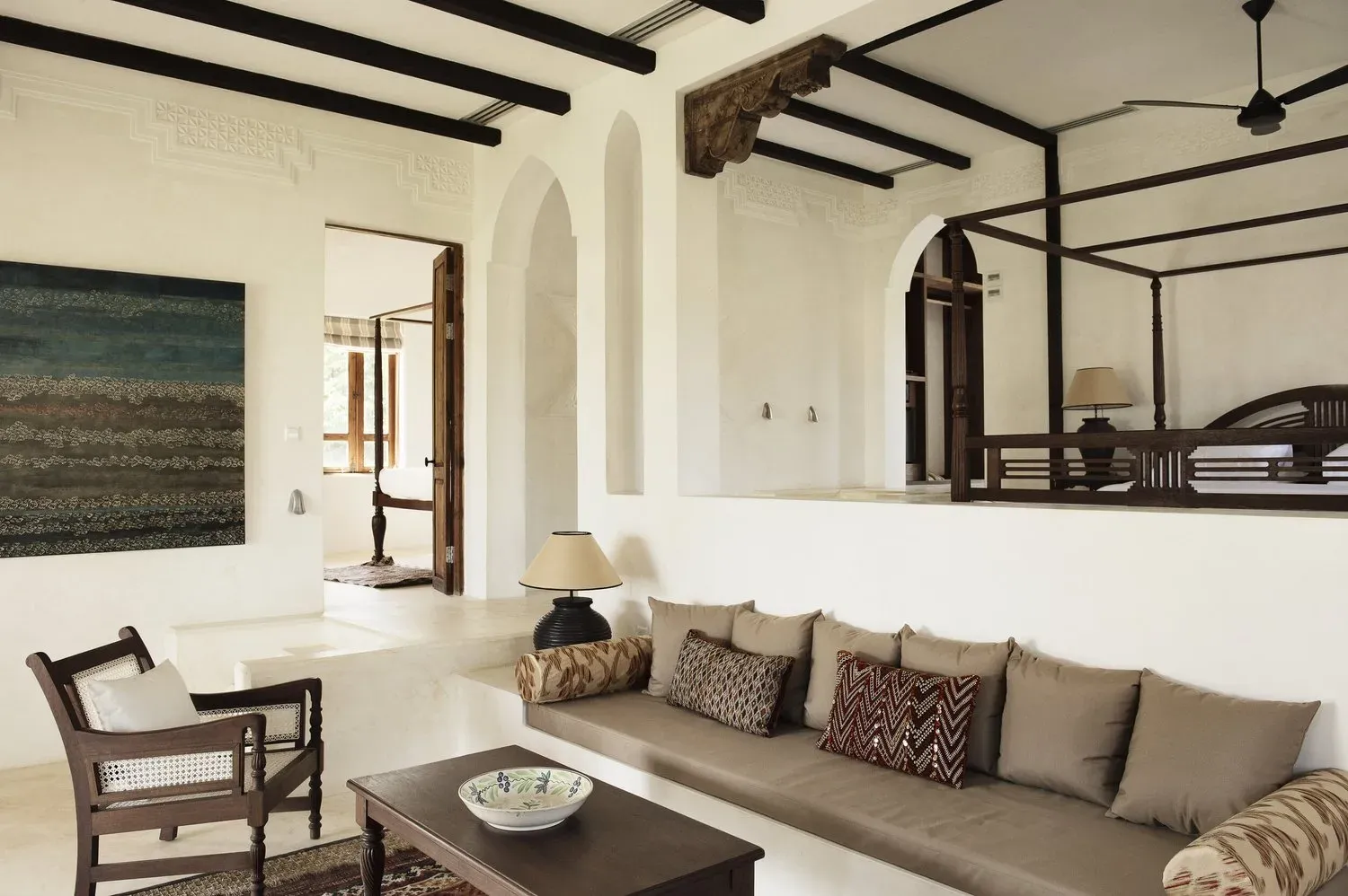 Coastal Villa interior at Qambani Luxury Resort with carved wooden furniture and antique Chinese porcelain