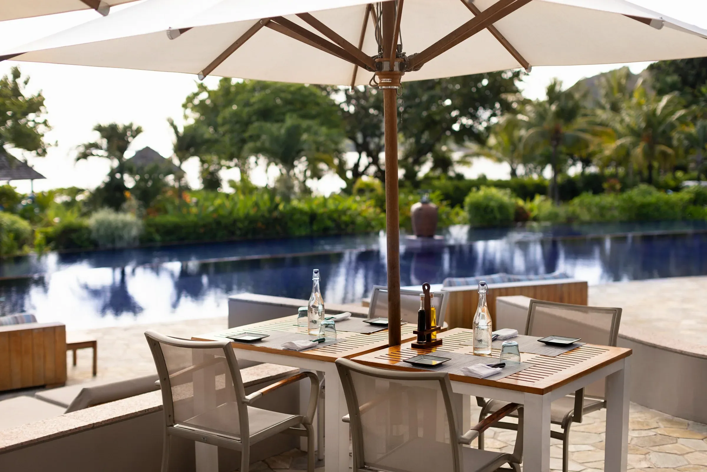 Poolside table setting at Pool Restaurant & Bar, Raffles Seychelles