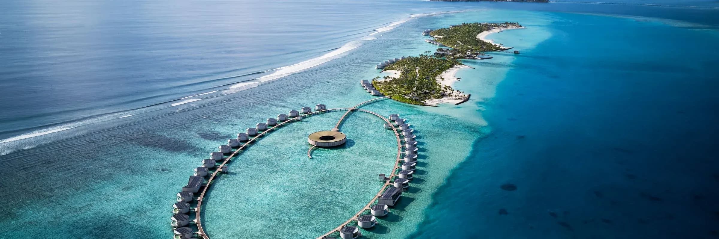 Aerial view of the ring of overwater villas at The Ritz-Carlton Maldives, Fari Islands