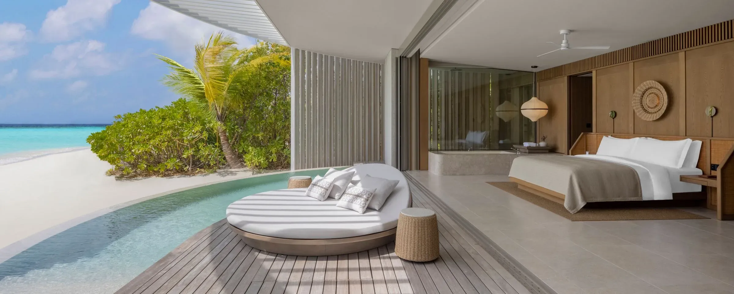 Private pool deck of a Sunset Beach Pool Villa at sunset, The Ritz-Carlton Maldives, Fari Islands