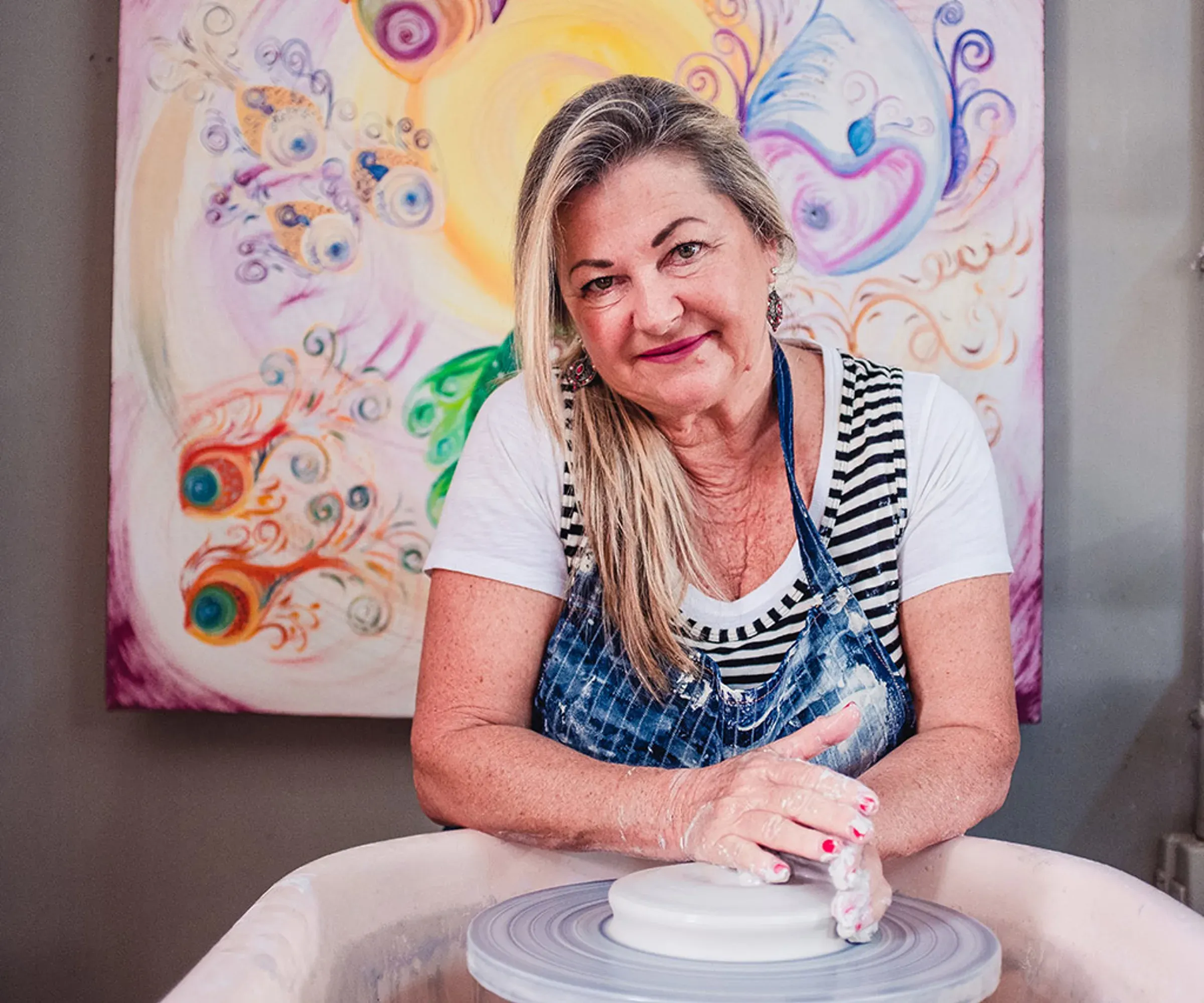 A local potter at her wheel, part of SALT of Palmar's Skill Swap experience