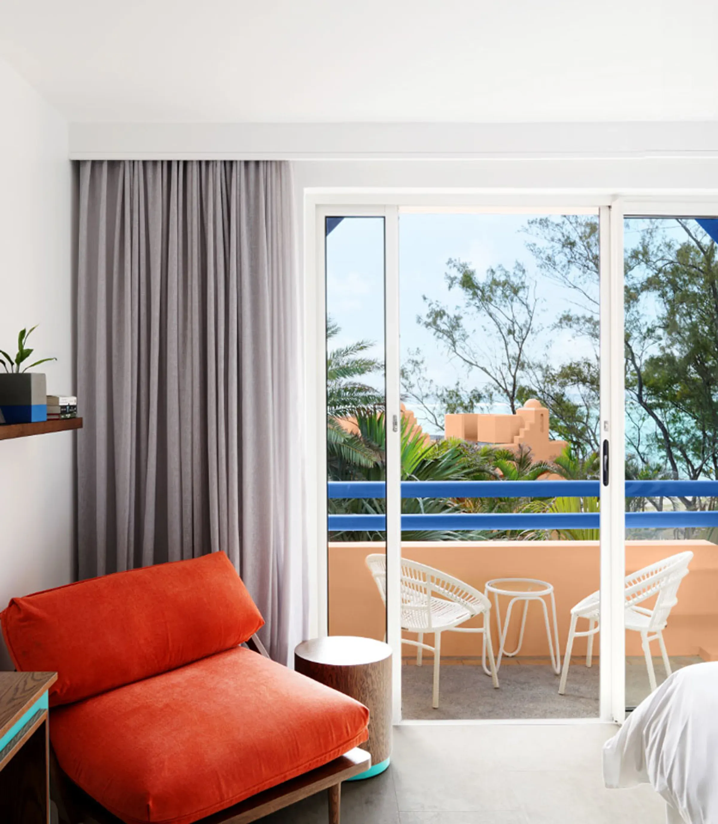 Garden View room lounge chair and balcony overlooking tropical gardens at SALT of Palmar