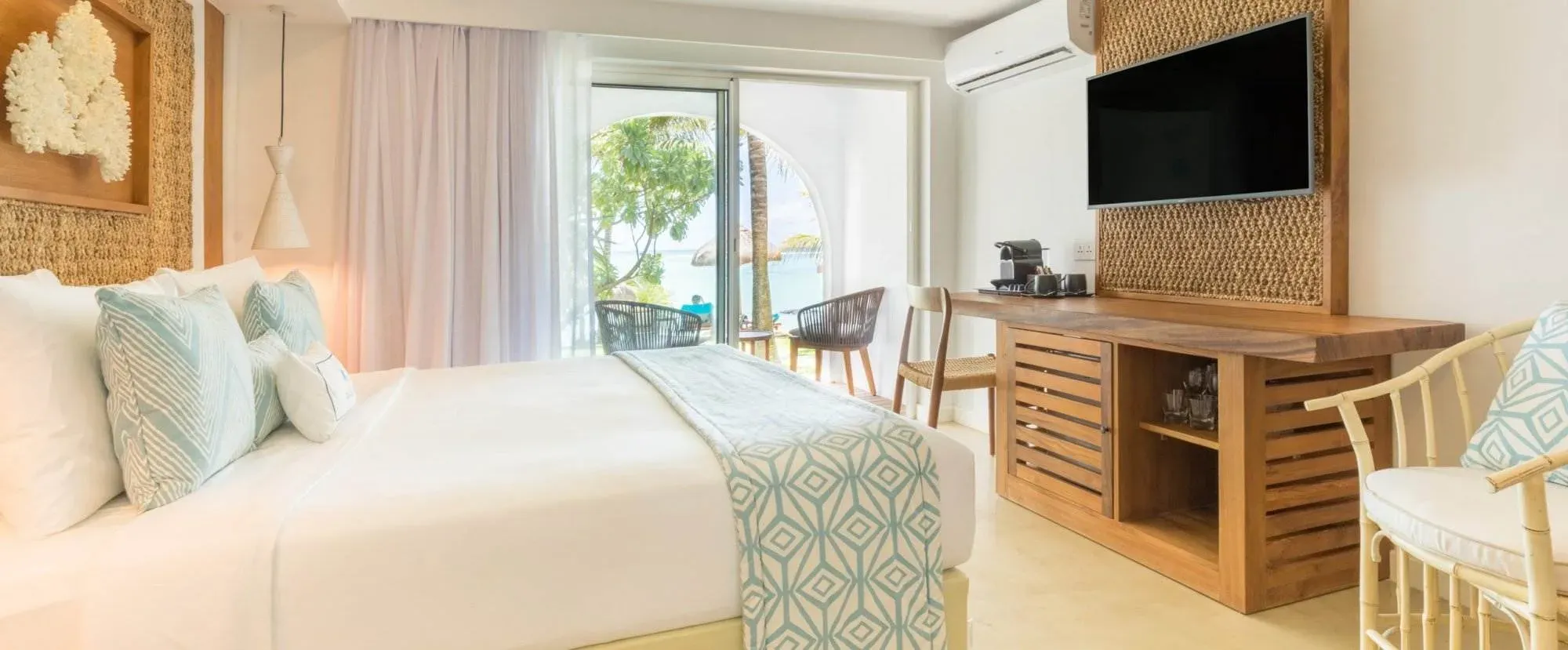 Charm Room interior with garden-facing terrace at Seasense Boutique Hotel & Spa