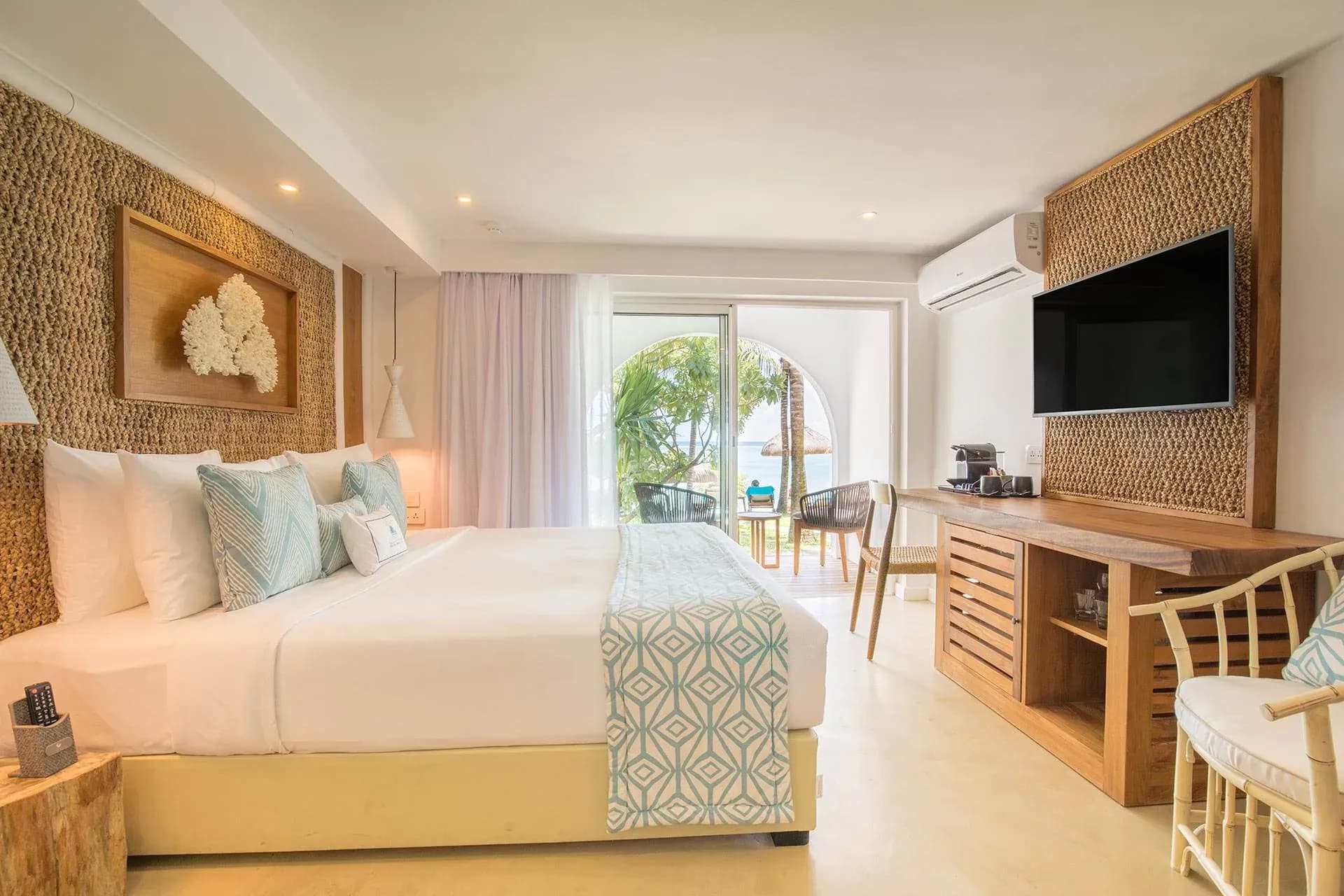 Deluxe Beachfront Room with terrace opening onto the beach at Seasense Boutique Hotel & Spa