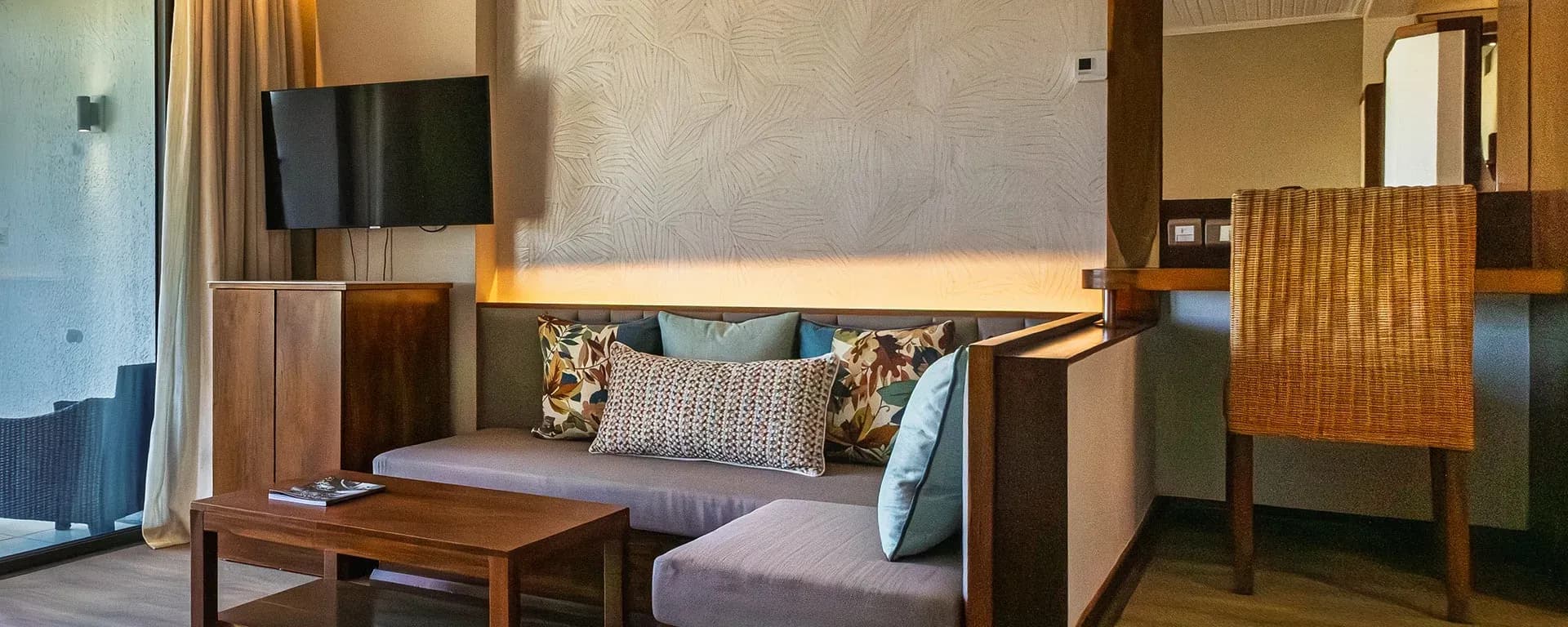 Tropical Room interior with balcony at Shandrani Beachcomber