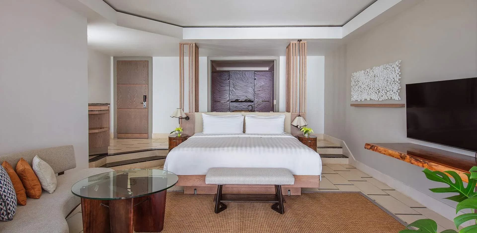 Frangipani Family Beachfront Suite bedroom at Shangri-La Le Touessrok