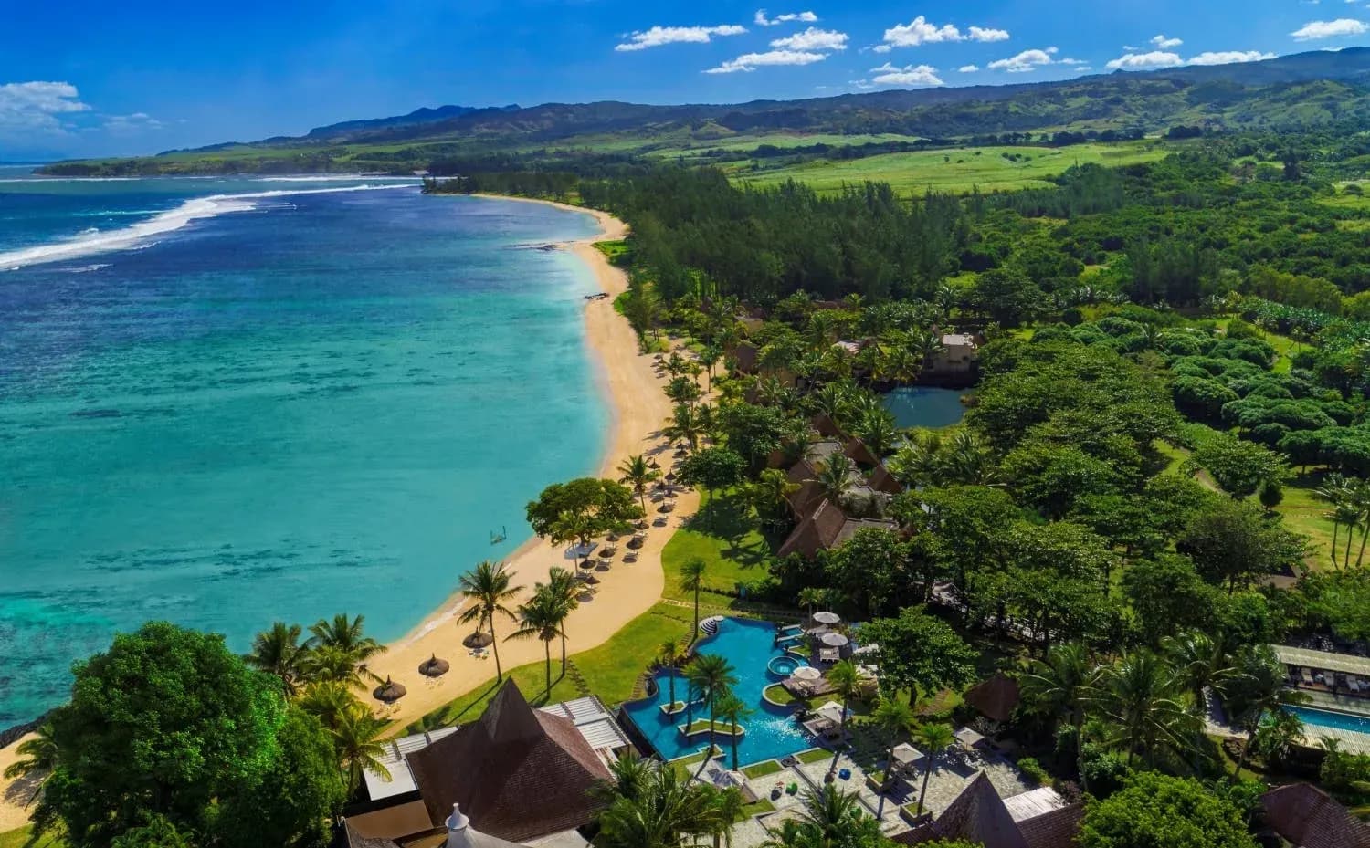 Aerial view of the resort beach and lagoon at Shanti Maurice Resort & Spa